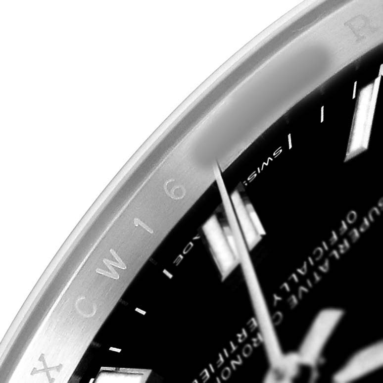 The image shows a close-up of the Rolex Oyster Perpetual 126000 Men's Stainless Steel Black Dial watch face, highlighting the dial, markers, and partial bezel with engraved text.