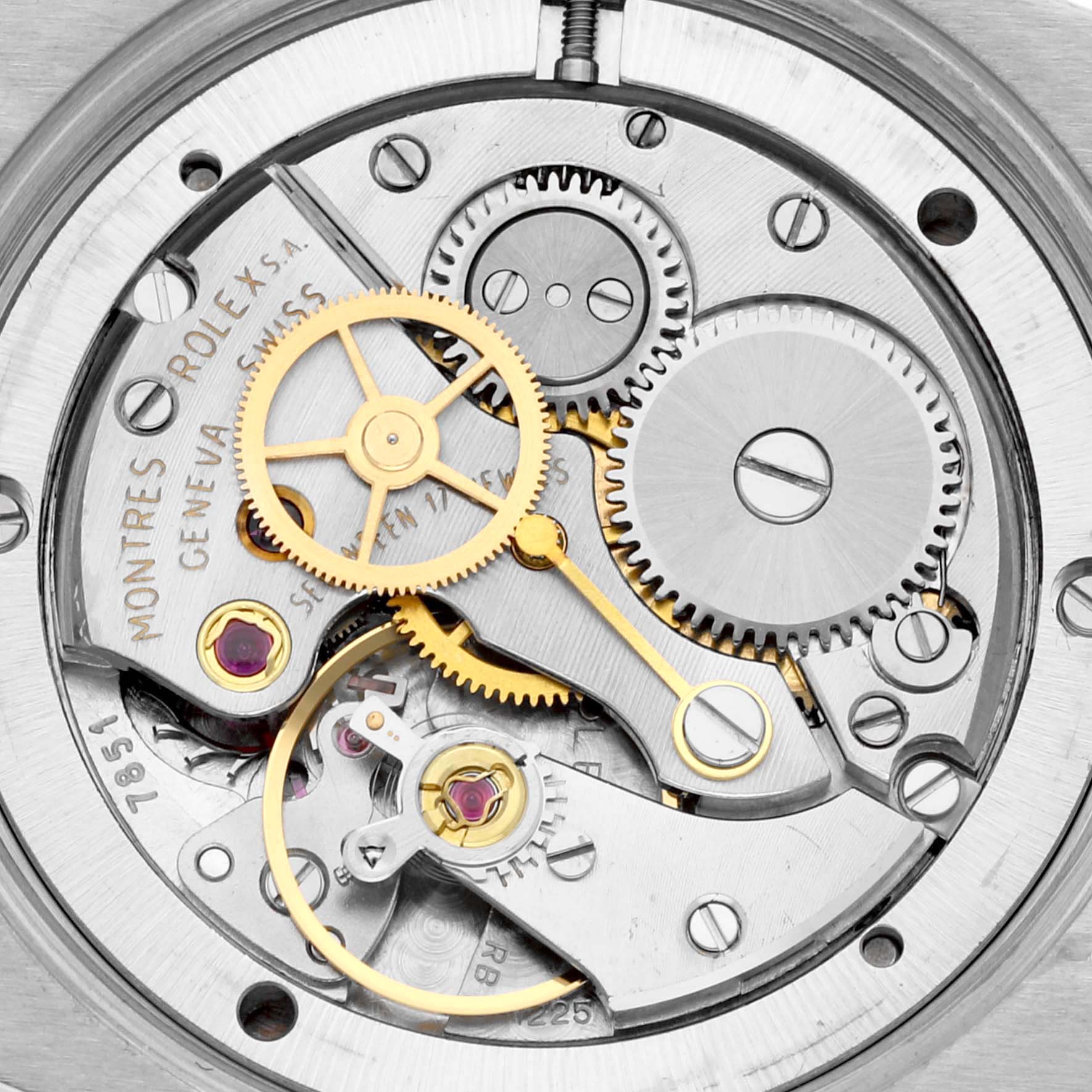 This image shows a close-up of the internal movement mechanism of a Rolex Vintage Collection 6694 Men's Stainless Steel Silver Dial 6694 Men's Stainless Steel Silver Dial watch, highlighting various gears and components.