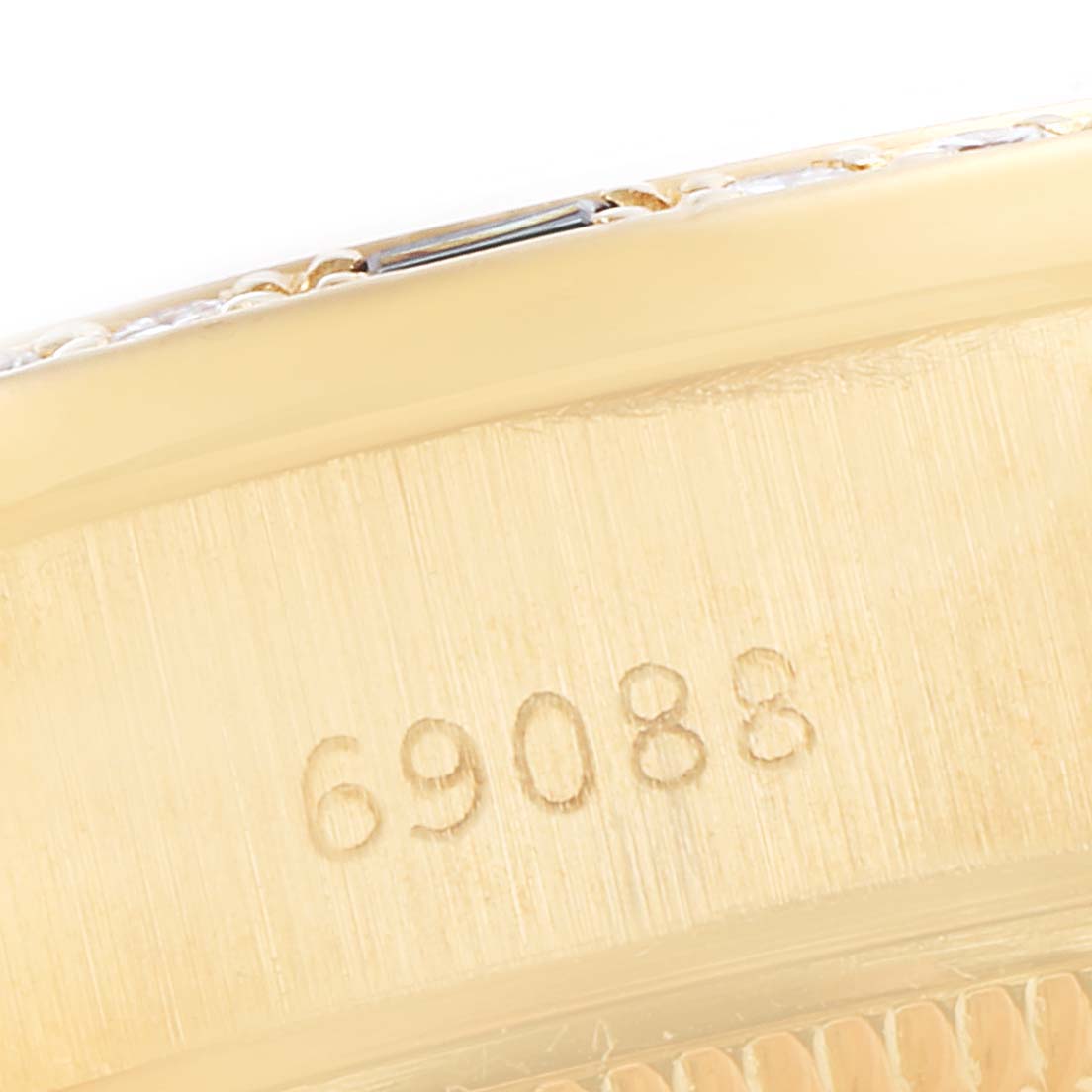 This image shows a close-up of the model number "69088" etched on the case of a Rolex President 69088 Women's Yellow Gold Champagne Dial 69088 Women's Yellow Gold Champagne Dial watch.