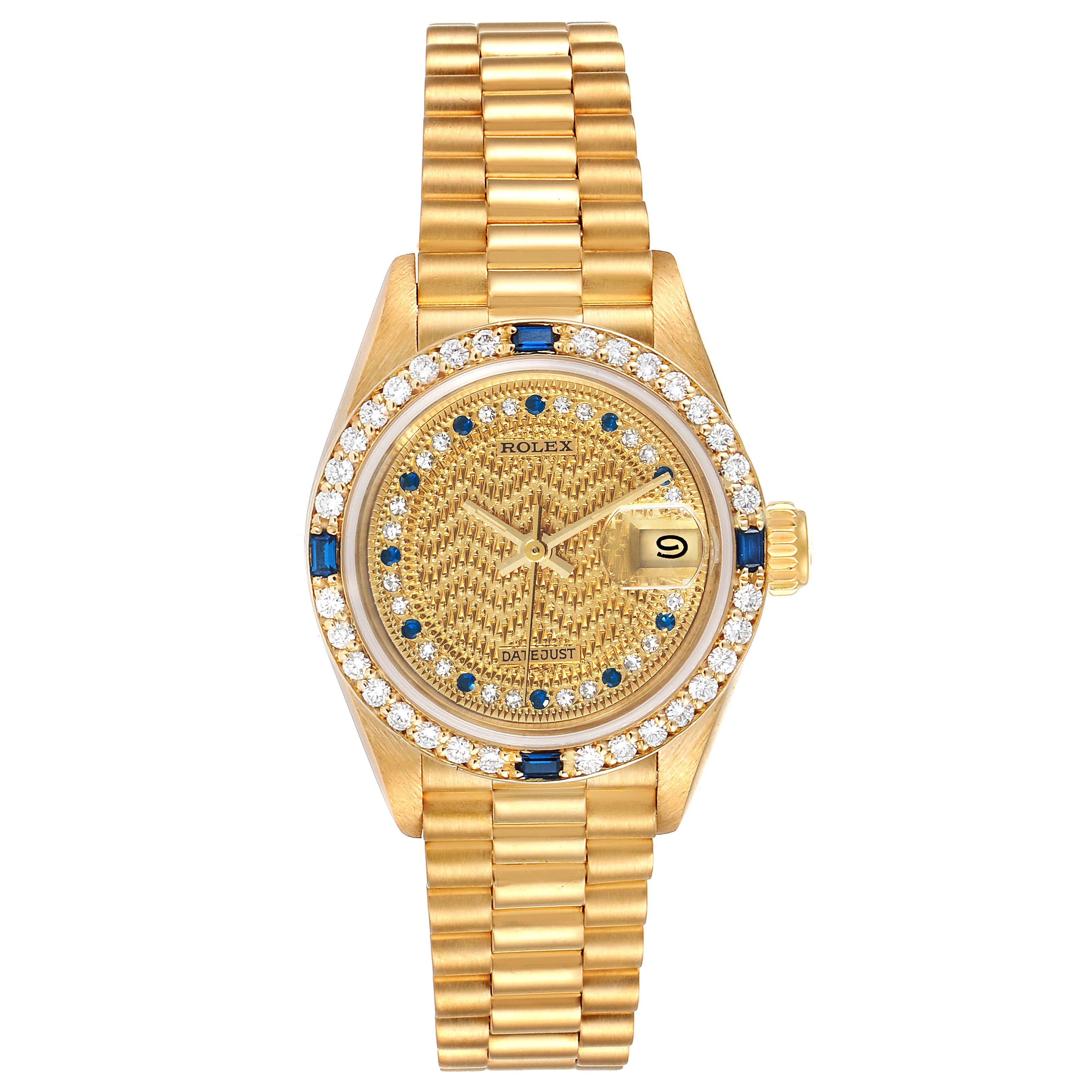 The image shows a top view of a Rolex President 69088 Women's Yellow Gold Champagne Dial 69088 Women's Yellow Gold Champagne Dial model watch, displaying its gold dial, gemstone bezel, and bracelet.