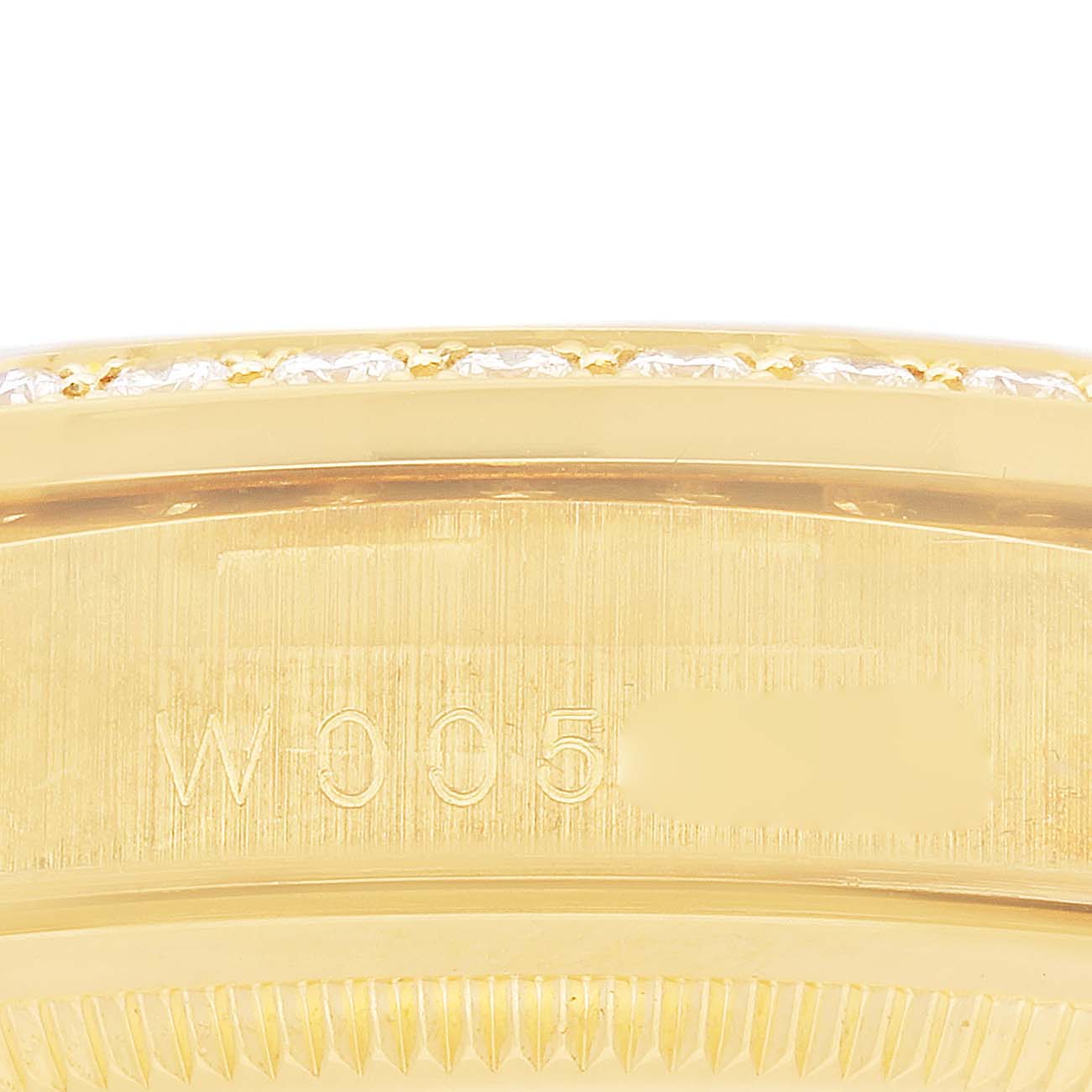 The image shows a close-up side view focusing on the engraved side of the Rolex President 18388 Men's Yellow Gold Champagne Dial 18388 Men's Yellow Gold Champagne Dial model with part of the bezel.