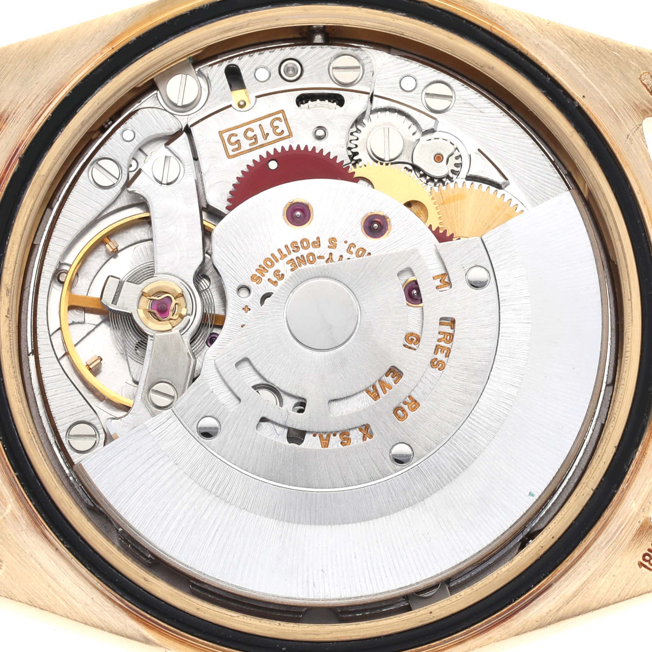 The image shows the movement of a Rolex President 18388 Men's Yellow Gold Champagne Dial 18388 Men's Yellow Gold Champagne Dial watch from a rear angle, highlighting gears and the rotor.