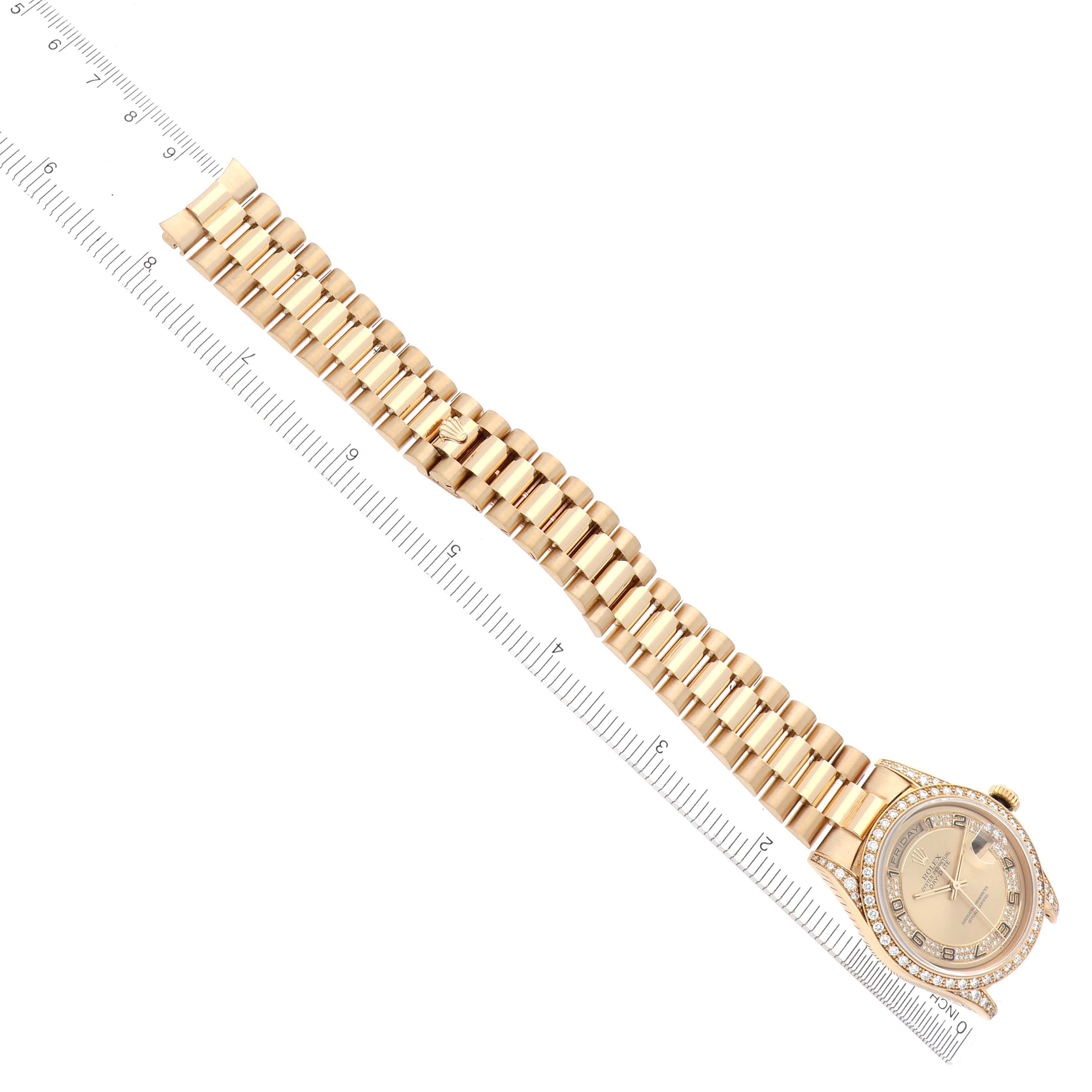 The Rolex President 18388 Men's Yellow Gold Champagne Dial 18388 Men's Yellow Gold Champagne Dial watch is shown from an overhead angle, displaying the dial, bezel, and full bracelet alongside a ruler.