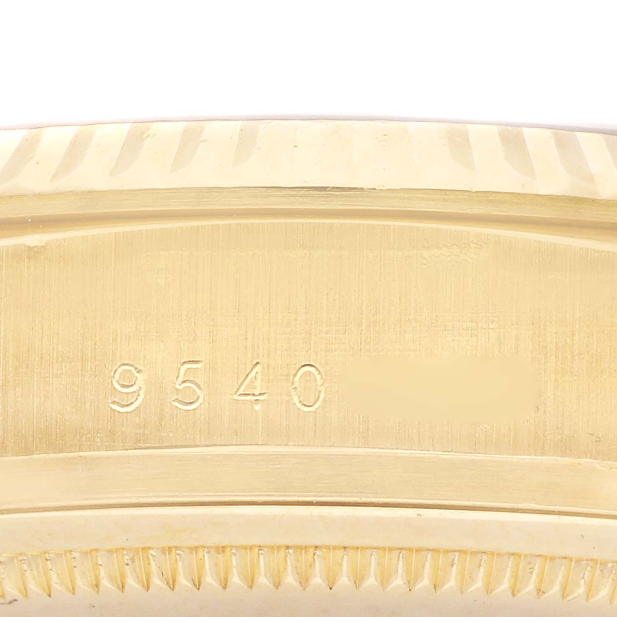 The image shows the side case and serial number of a Rolex President 18038 Men's Yellow Gold Silver Dial 18038 Men's Yellow Gold Silver Dial model.