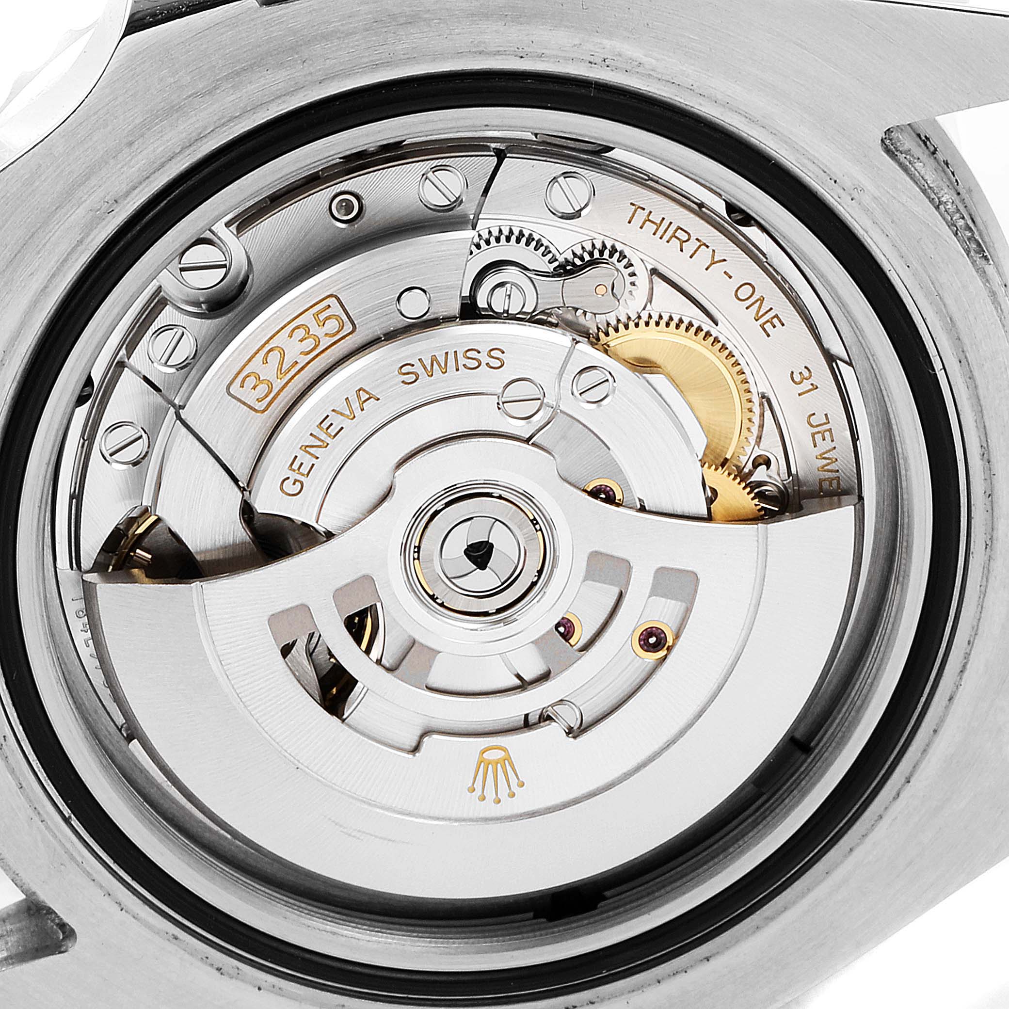 The image shows a close-up view of the movement mechanism inside a Rolex Sea-Dweller 126600 Men
s Stainless Steel Black Dial 126600 Men
s Stainless Steel Black Dial watch.