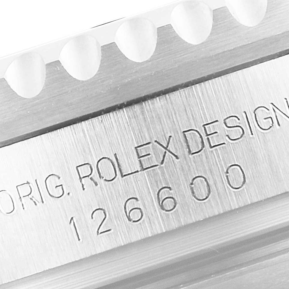 This image shows a close-up of the engraved model number "126600" on the bezel of a Rolex Sea-Dweller 126600 Men
s Stainless Steel Black Dial 126600 Men
s Stainless Steel Black Dial watch.