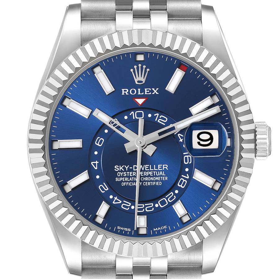 The Rolex Sky-Dweller watch is shown from the front, highlighting the blue dial, bezel, and crown.