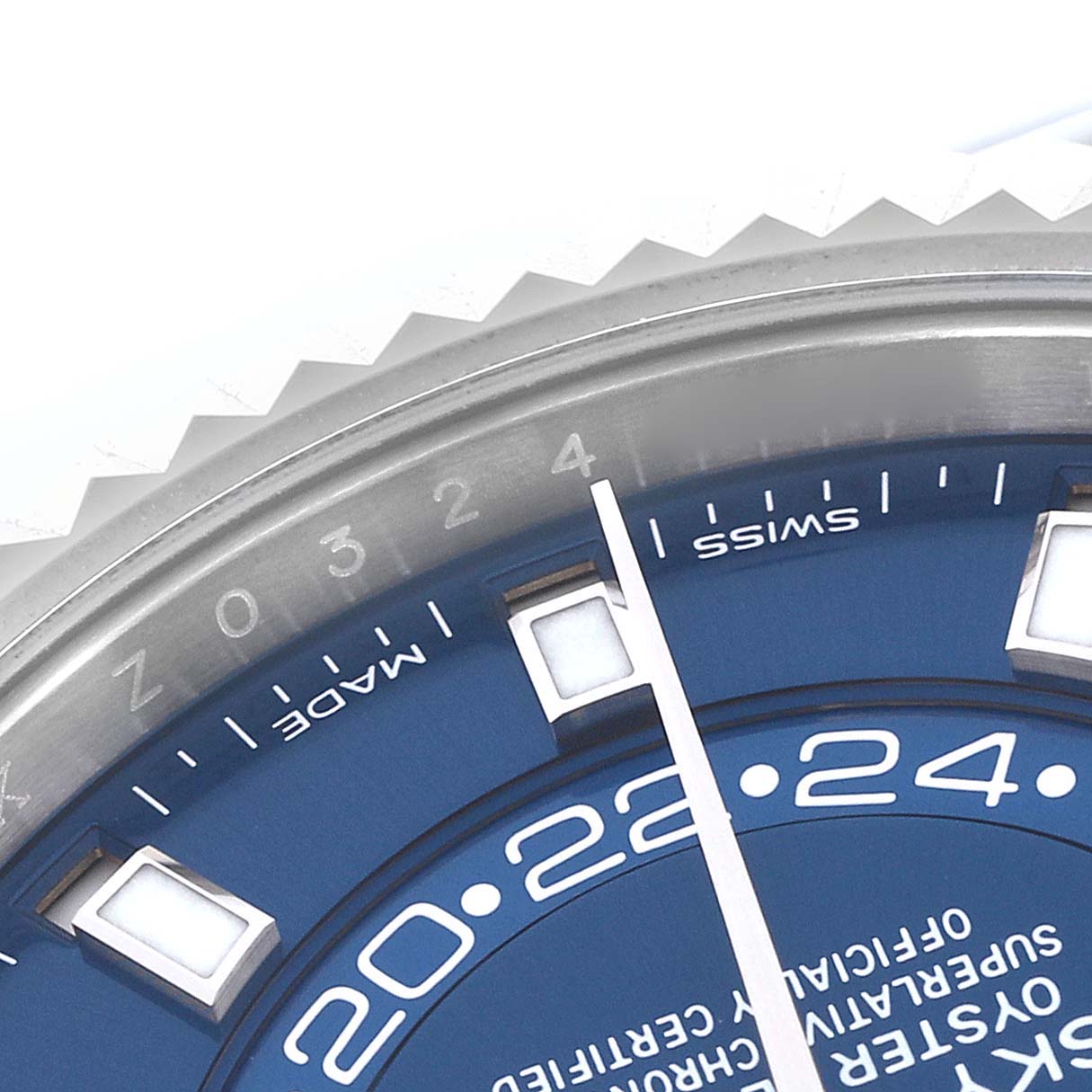 The image shows a partial view of the Rolex Sky-Dweller 326934 Men's Stainless Steel Blue Dial 326934 Men's Stainless Steel Blue Dial's blue dial and bezel from a close-up angle.
