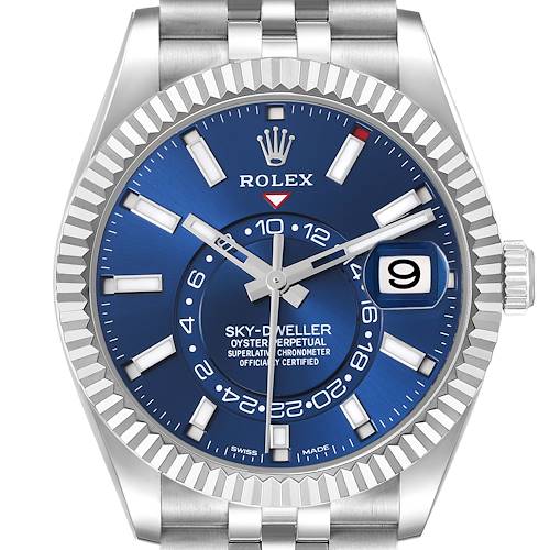 The Rolex Sky-Dweller watch is shown from a front angle, featuring its blue dial, bezel, hands, and date display.