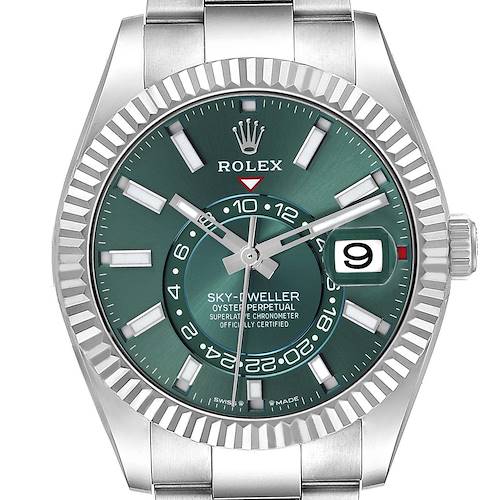 The Rolex Sky-Dweller is shown from a front angle, highlighting the dial, bezel, hands, and date window.