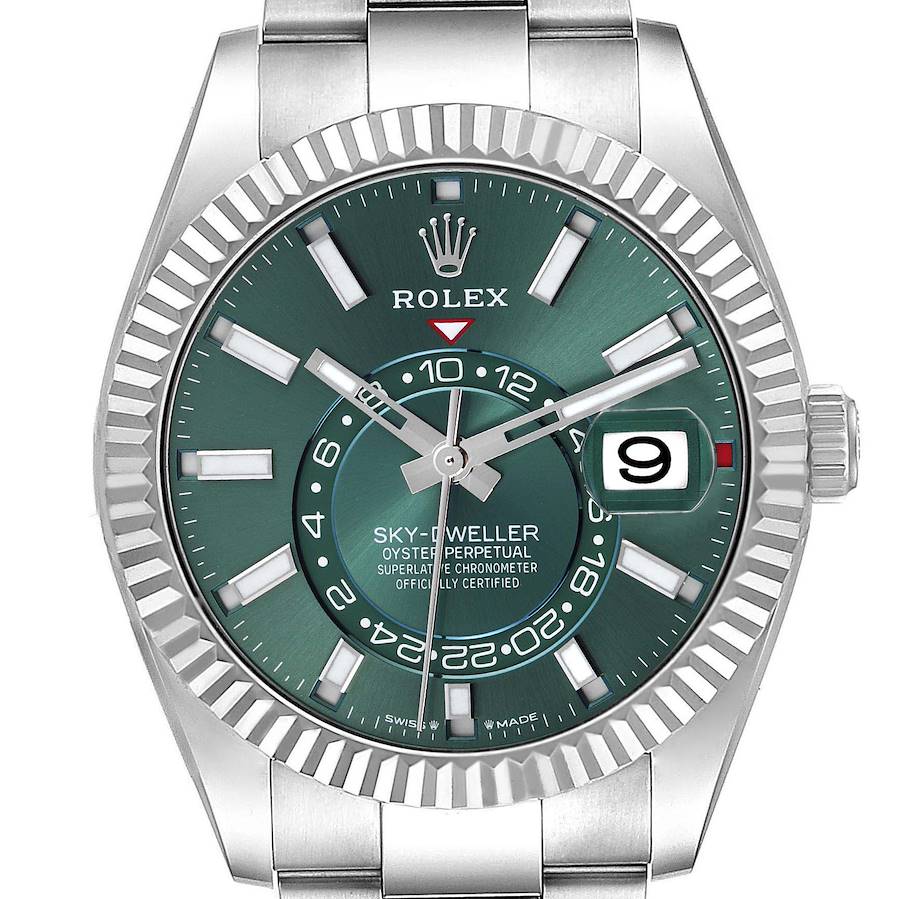 The Rolex Sky-Dweller watch is shown from the front, displaying the green dial, bezel, date, and bracelet.