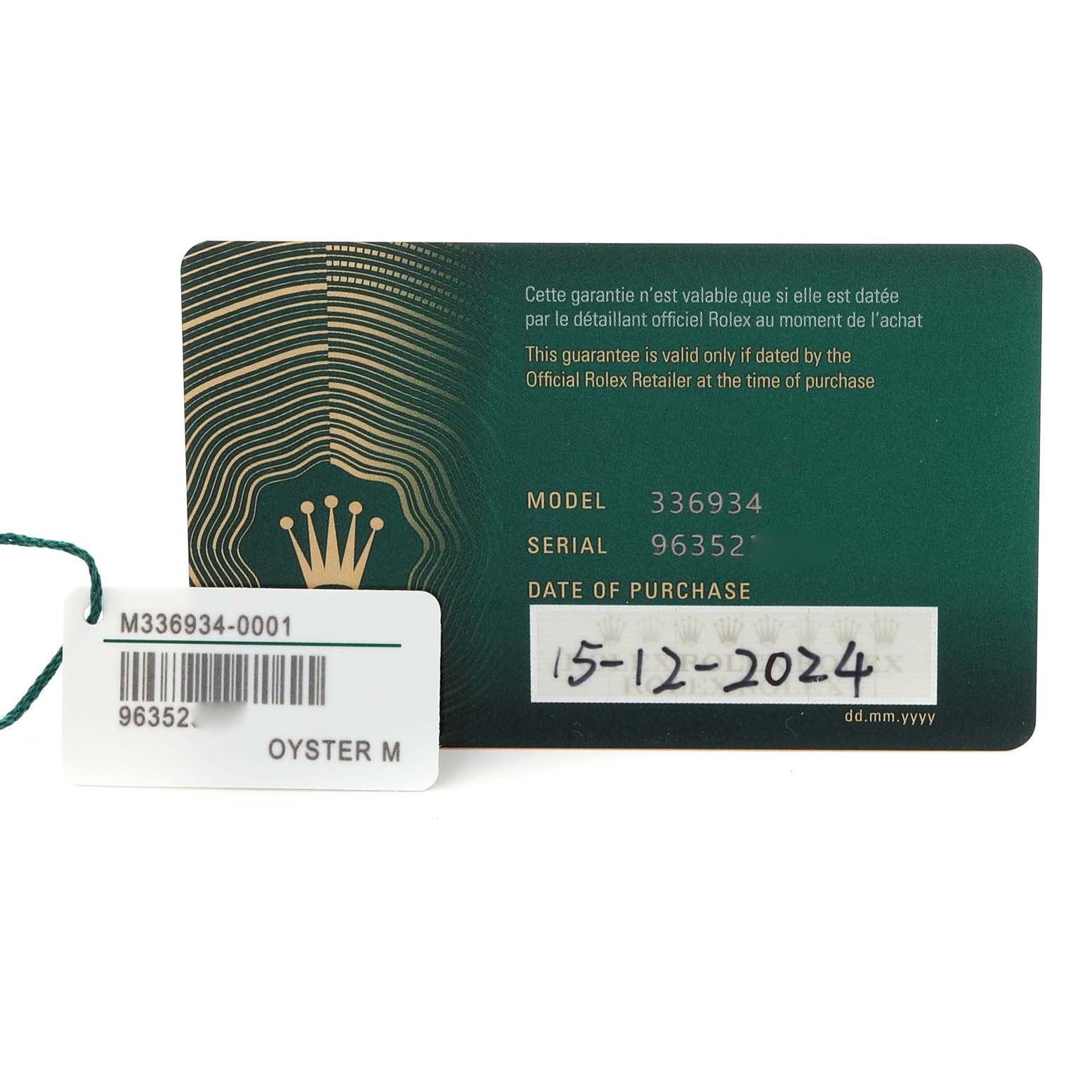 The image shows a Rolex Sky-Dweller 336934 Men's Stainless Steel Green Dial 336934 Men's Stainless Steel Green Dial warranty card and tag, displaying model and serial numbers.