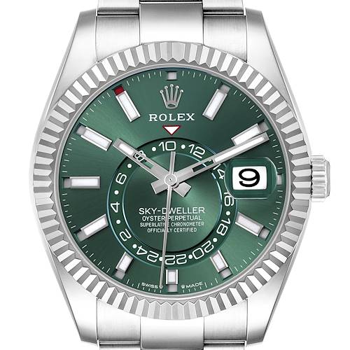 The image shows a front view of the Rolex Sky-Dweller watch, displaying the green dial, fluted bezel, and bracelet.