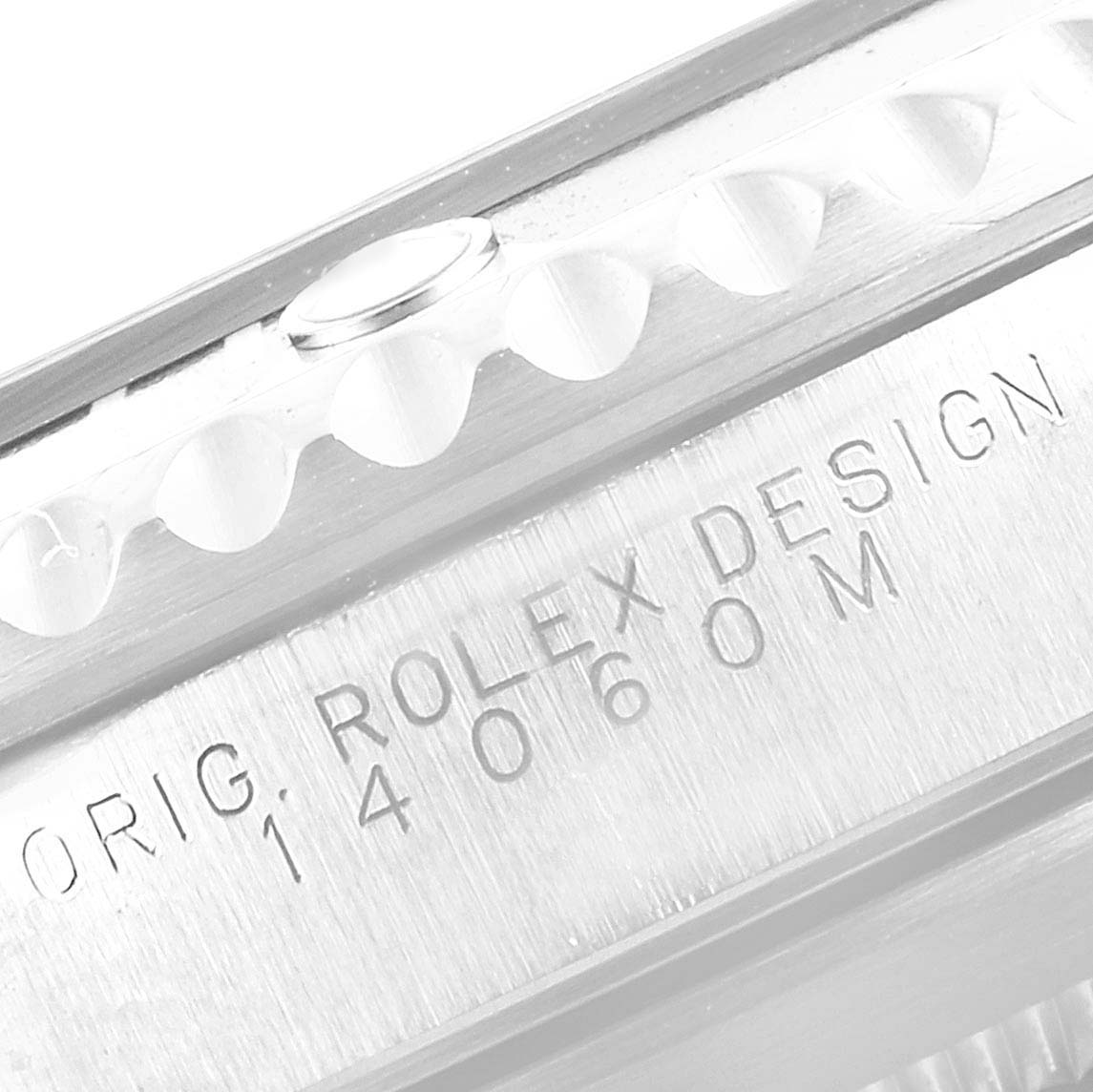 The image shows a close-up of the engraving on the side of the Rolex Submariner 14060 Men's Stainless Steel Black Dial 14060 Men's Stainless Steel Black Dial watch case, highlighting its design and model number.