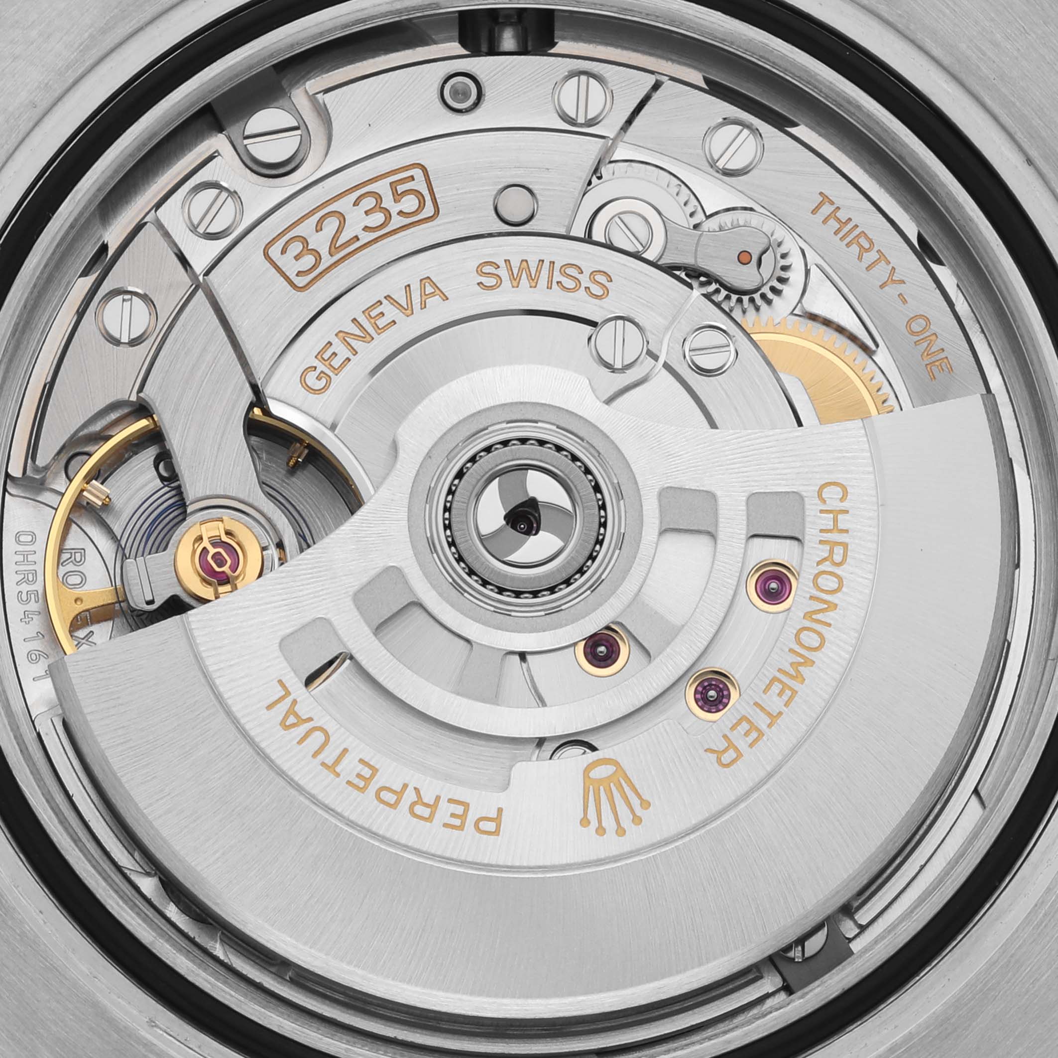 The image shows a close-up of the Rolex Submariner 126613LB Men's Steel and Gold (two tone) Blue Dial 126613LB Men's Steel and Gold (two tone) Blue Dial's movement, revealing the intricate inner mechanics and rotor.