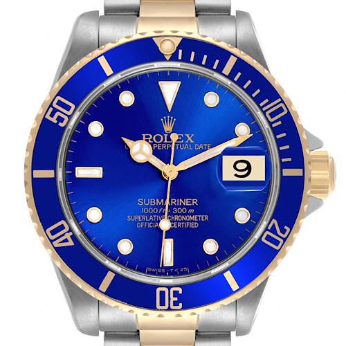 The Rolex Submariner watch is shown from the front, highlighting its blue dial, bezel, and gold-tone hands and markers.