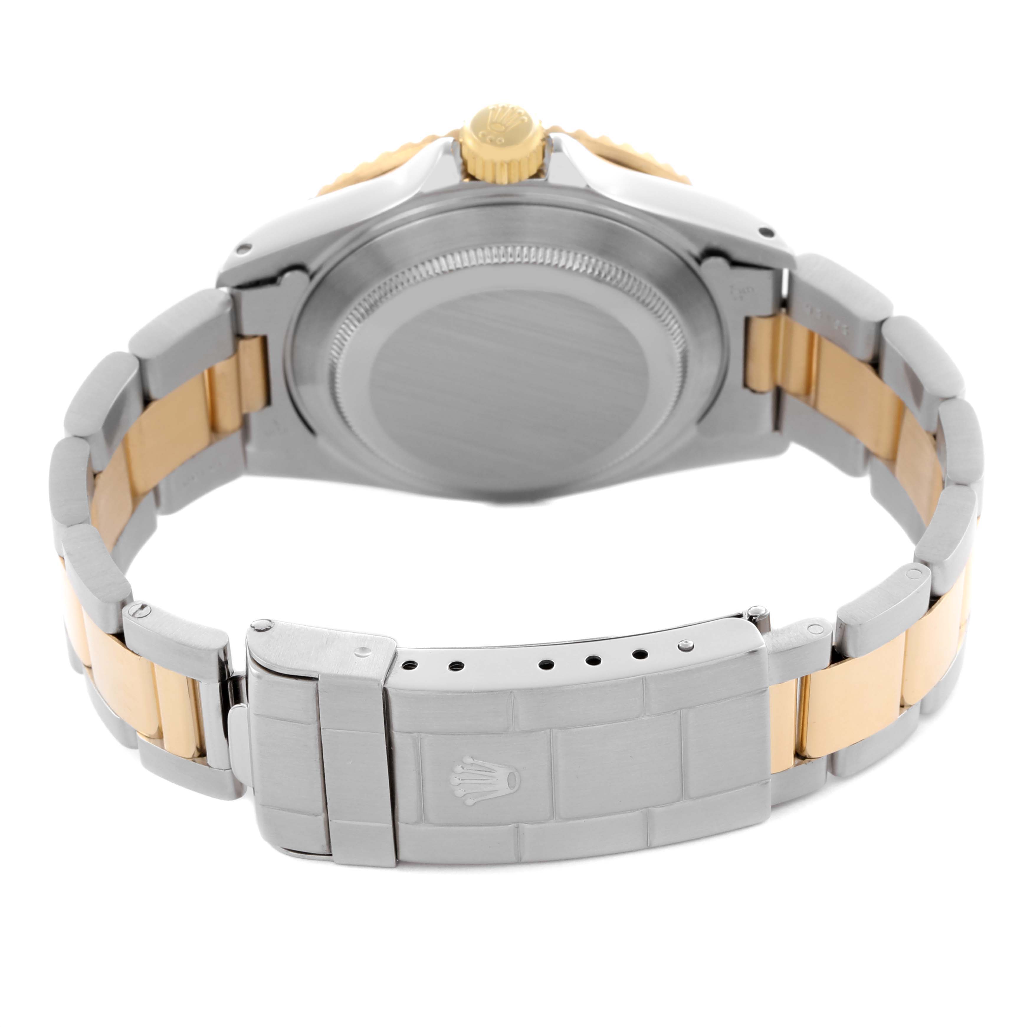 The image shows the back view of a Rolex Submariner 16613 Men's Steel and Gold (two tone) Blue Dial 16613 Men's Steel and Gold (two tone) Blue Dial, highlighting the bracelet and clasp.