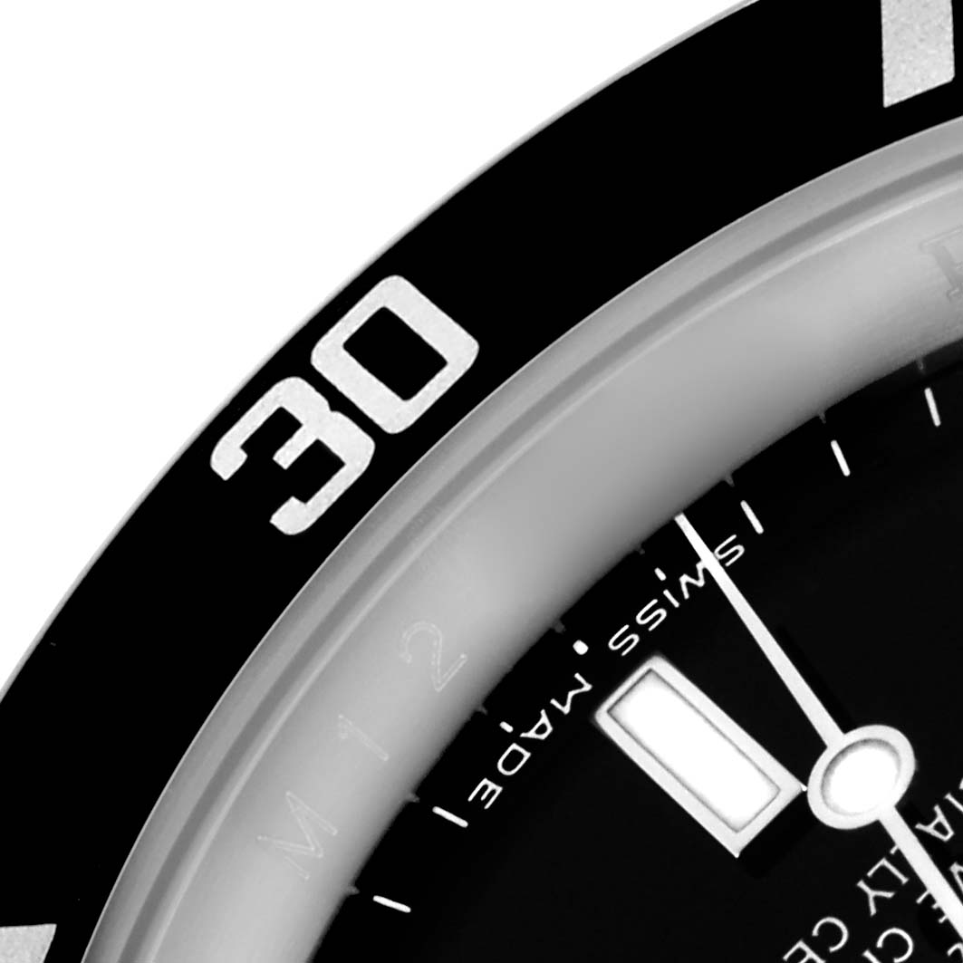 The image shows a close-up angle of the bezel and part of the dial of a Rolex Submariner 16610 Men's Stainless Steel Black Dial 16610 Men's Stainless Steel Black Dial watch.
