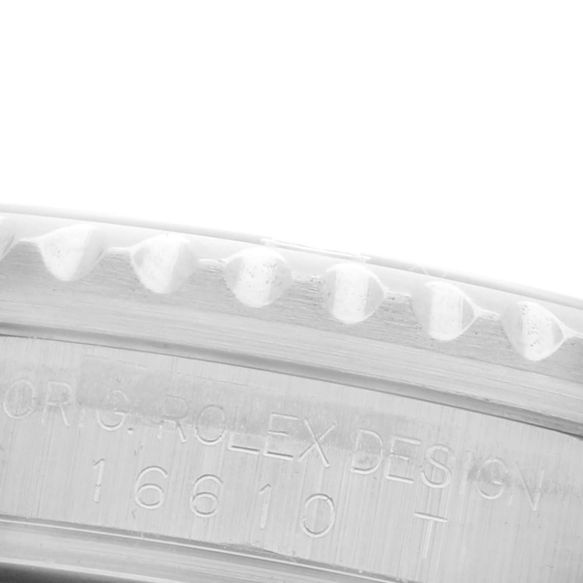The image displays a close-up of the bezel and engraved side of a Rolex Submariner 16610 Men's Stainless Steel Black Dial 16610 Men's Stainless Steel Black Dial watch.