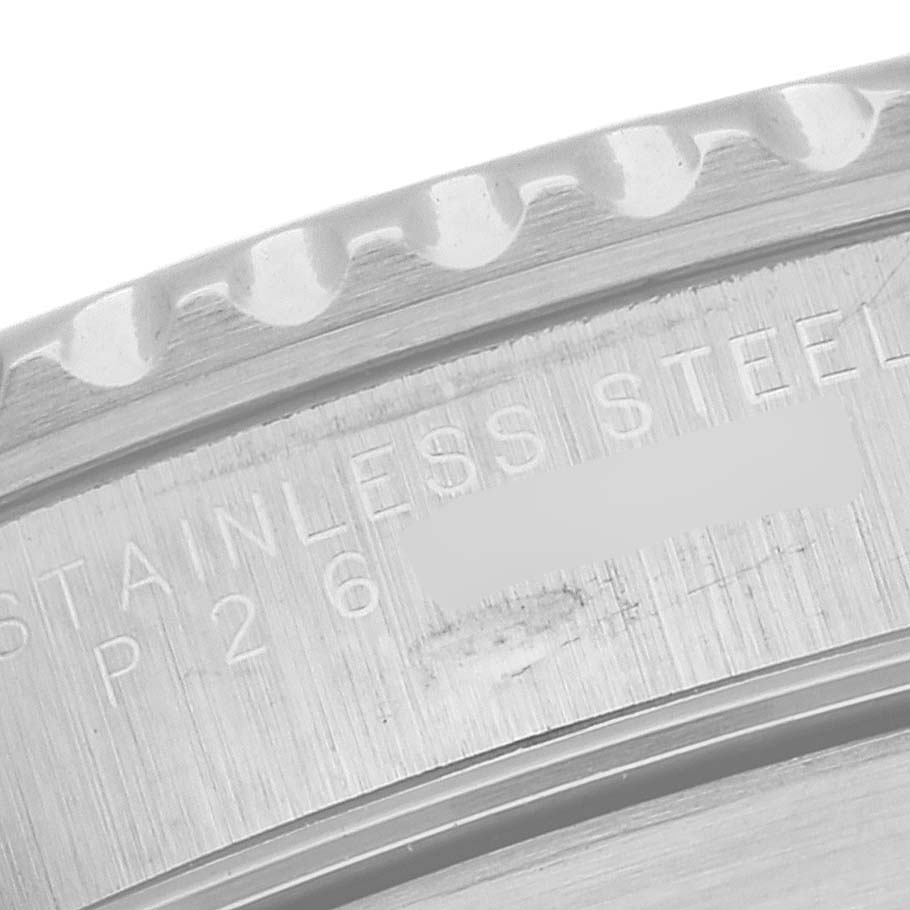 The image shows a close-up of the bezel and part of the case back of a Rolex Submariner 14060 Men
s Stainless Steel Black Dial 14060 Men
s Stainless Steel Black Dial, highlighting the "STAINLESS STEEL" engraving.