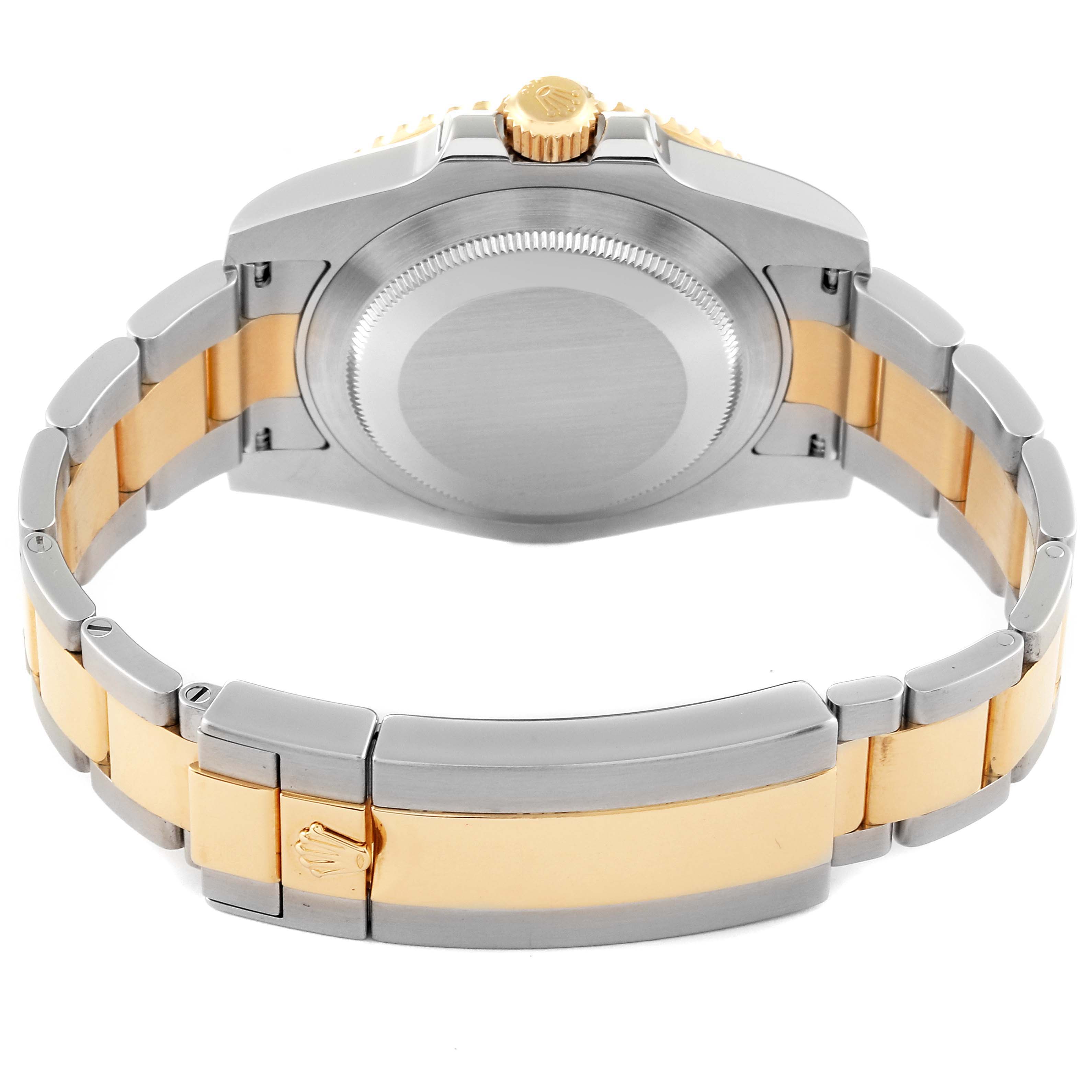 This image shows the back view of a Rolex Submariner 116613 Men's Steel and Gold (two tone) Black Dial 116613 Men's Steel and Gold (two tone) Black Dial watch, highlighting the case back and two-tone bracelet with the clasp.