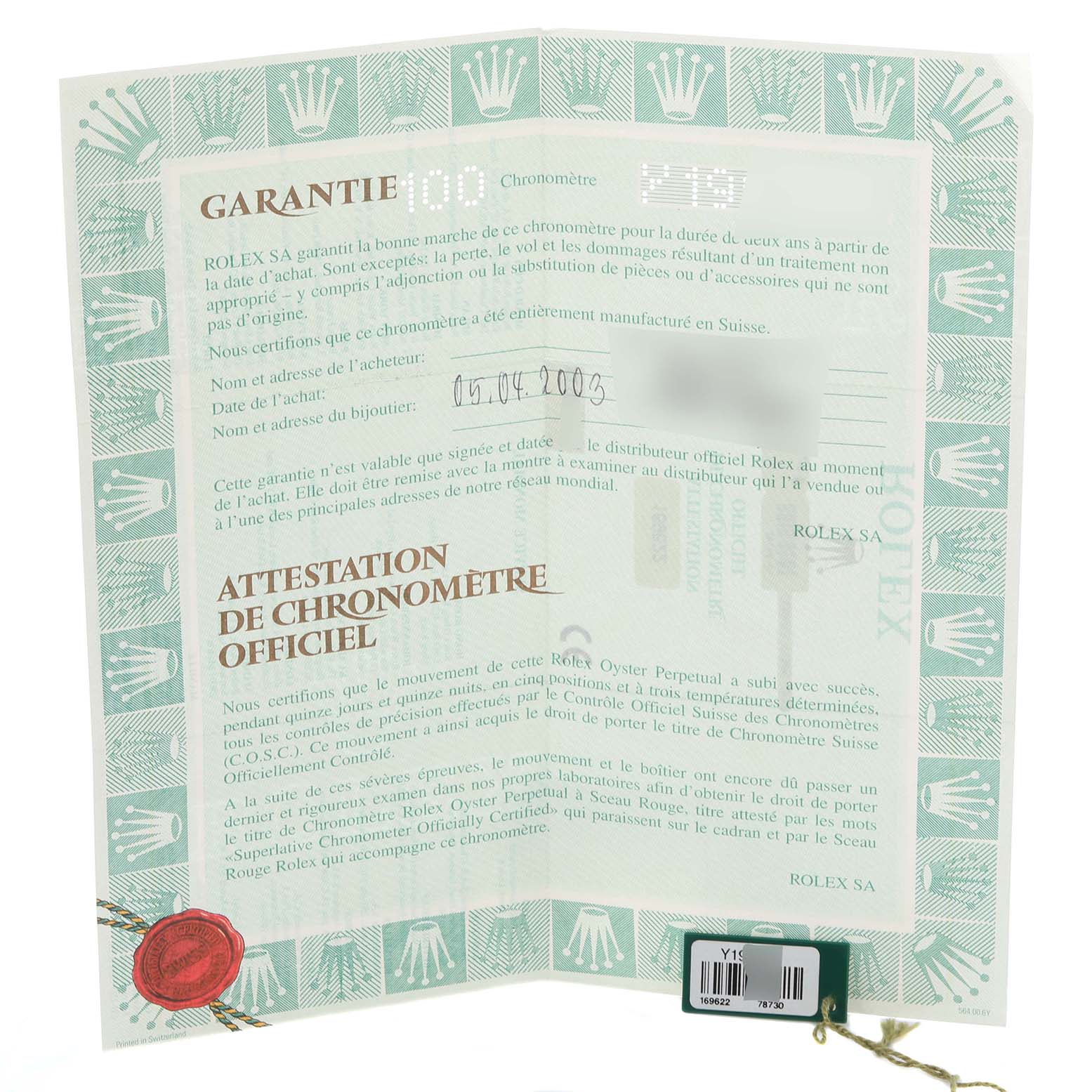 The image shows a Rolex Yacht-Master 169622 Women's Stainless Steel Grey Dial 169622 Women's Stainless Steel Grey Dial warranty certificate and tag, photographed at an angle without the watch itself.