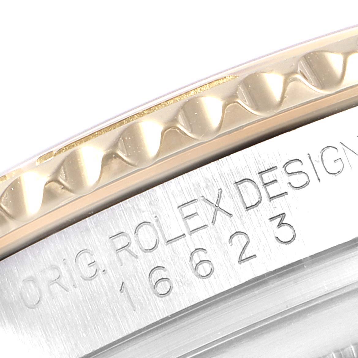 The image shows a close-up of the side engraving and bezel of a Rolex Yacht-Master 16623 Men
s Steel and Gold (two tone) Mother of Pearl Dial 16623 Men
s Steel and Gold (two tone) Mother of Pearl Dial watch.
