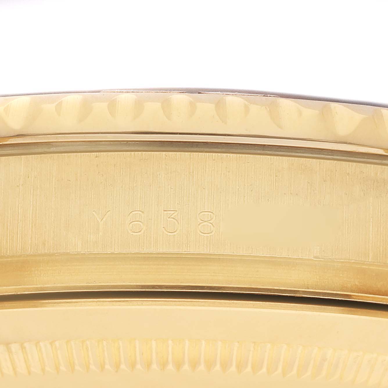 The image shows a close-up of the case side of a Rolex Yacht-Master 16628 Men's Yellow Gold Mother of Pearl Dial 16628 Men's Yellow Gold Mother of Pearl Dial, highlighting the engraved serial number.