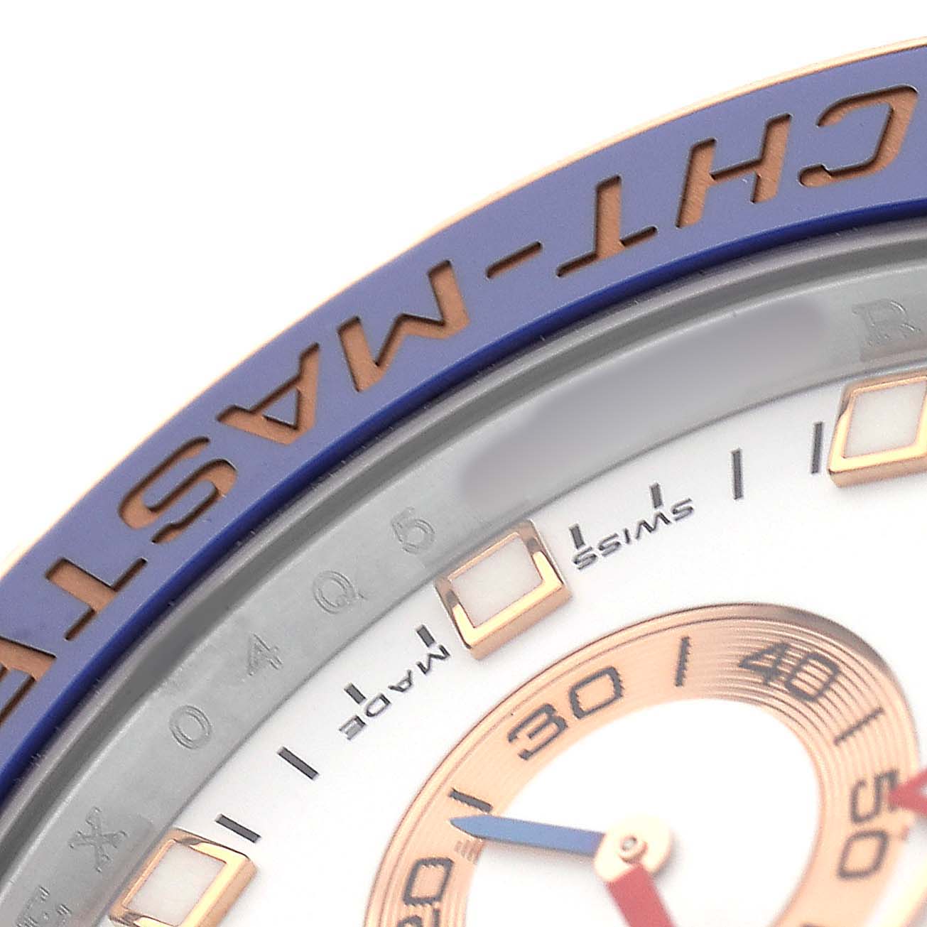 The image shows a close-up of part of the bezel and dial of a Rolex Yacht-Master 116681M Men's Steel and Gold (two tone) White Dial watch, highlighting the "CHT-MASTER" text.