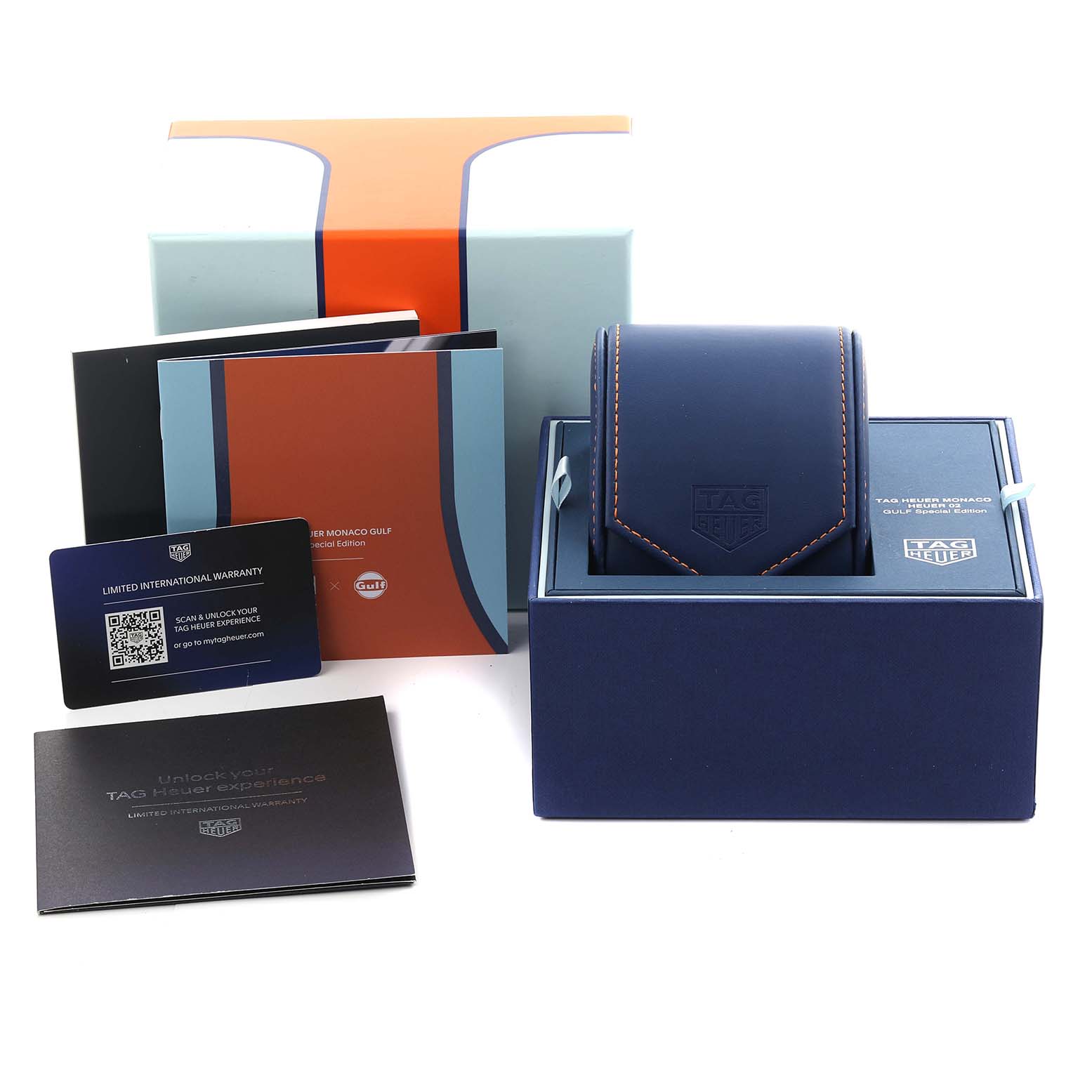 The image shows the Tag Heuer Monaco CBL2115.FC6494 Men's Stainless Steel Blue Dial CBL2115.FC6494 Men's Stainless Steel Blue Dial watch box, warranty cards, booklets, and packaging, viewed from the front.