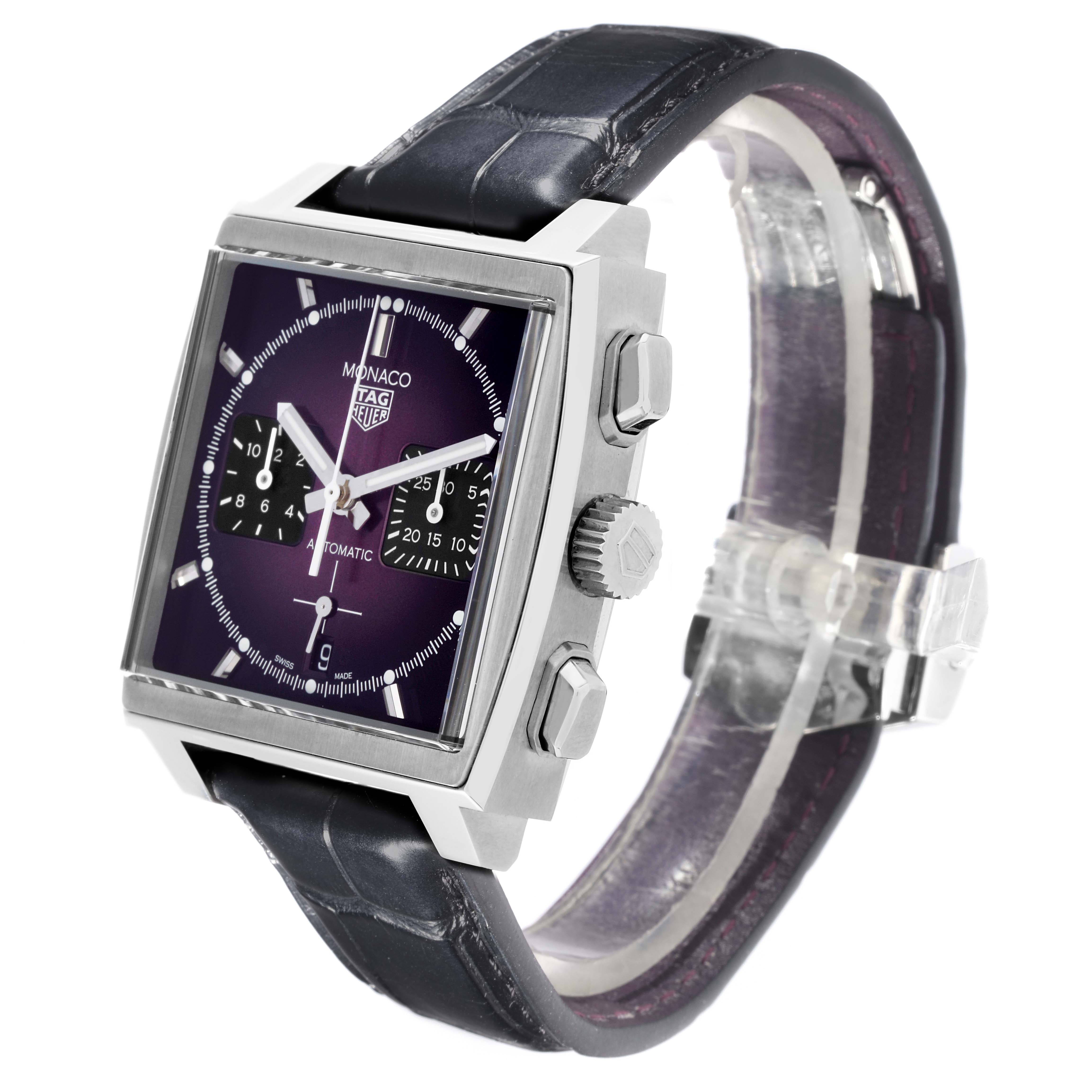 The Tag Heuer Monaco CBL2118.FC6518 Men's Stainless Steel Purple Dial CBL2118.FC6518 Men's Stainless Steel Purple Dial watch is shown from a side angle, highlighting its square face, chronograph dials, crown, and leather strap.