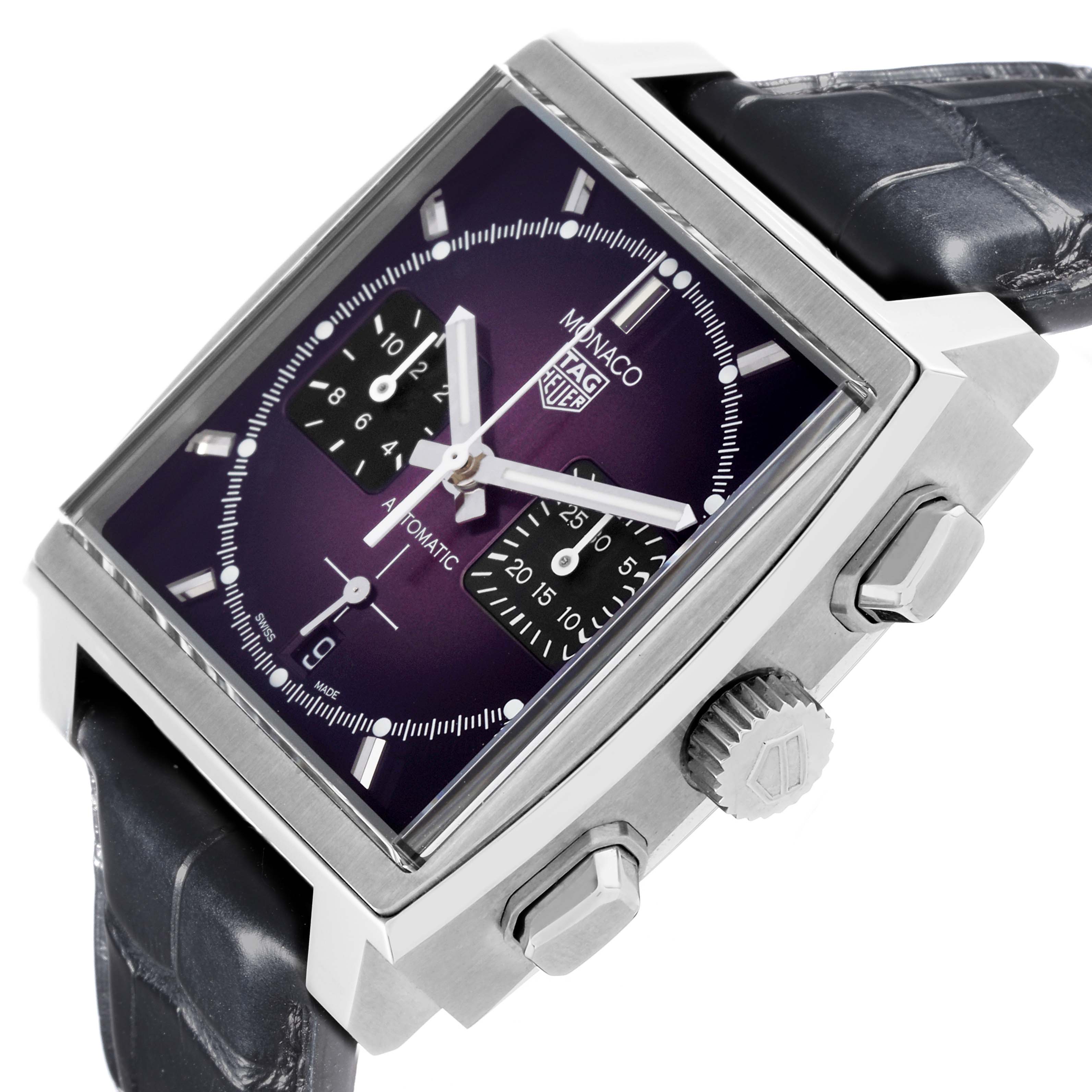 The Monaco watch by Tag Heuer is shown at an angle highlighting its face, side buttons, crown, and strap.