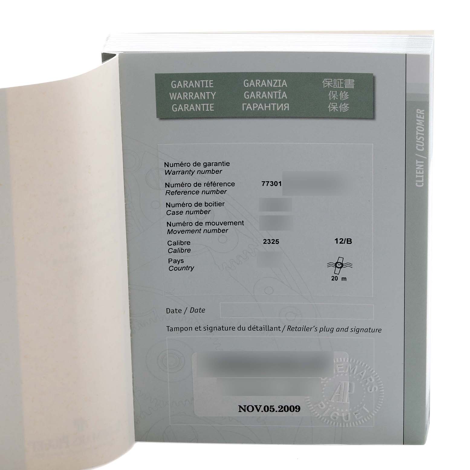 The image shows the open warranty booklet for an Audemars Piguet Millenary 77301ST.ZZ.D303CR.01 Women's White Gold Blue Dial 77301ST.ZZ.D303CR.01 Women's White Gold Blue Dial watch, displaying reference and movement details.