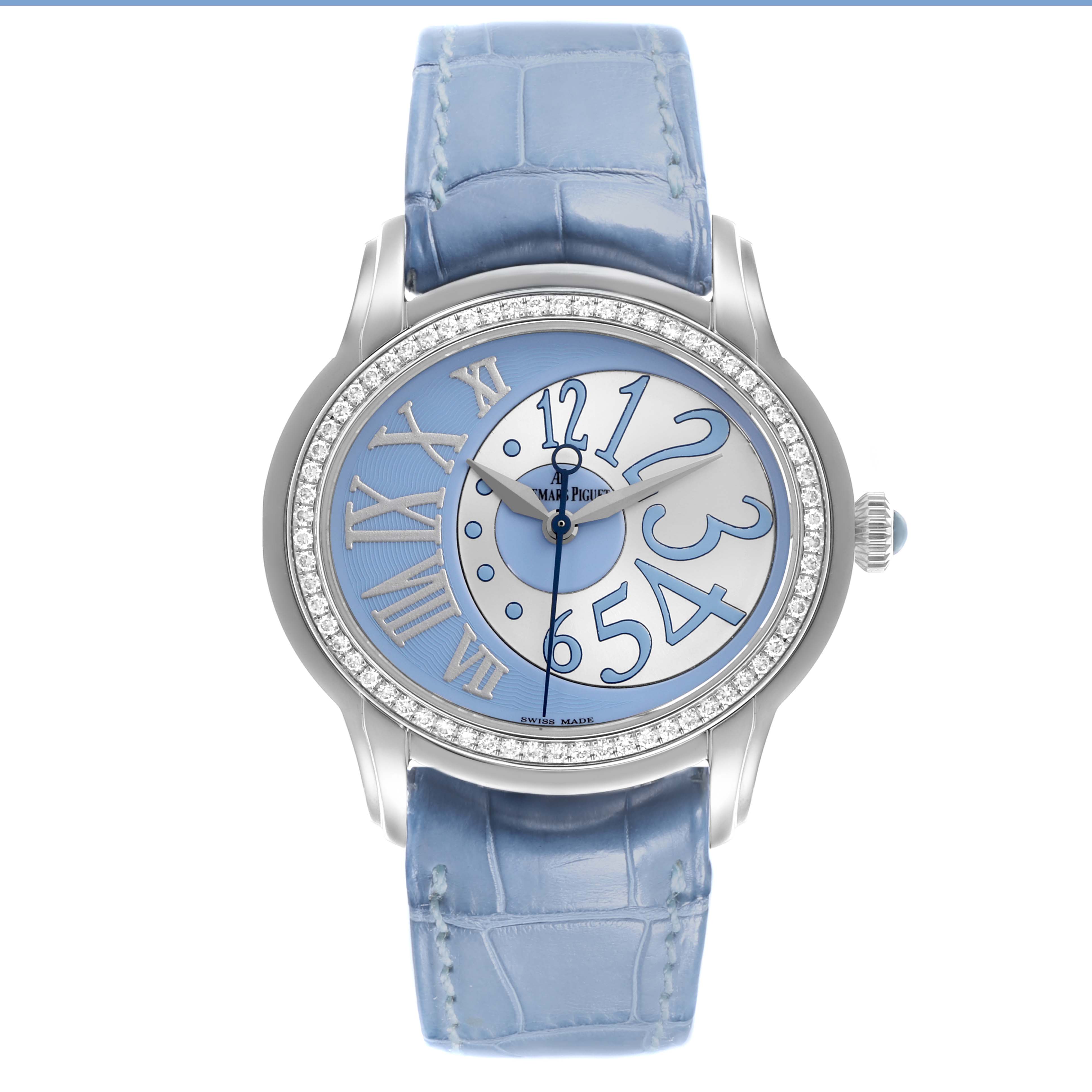 The Audemars Piguet Millenary 77301ST.ZZ.D303CR.01 Women's White Gold Blue Dial 77301ST.ZZ.D303CR.01 Women's White Gold Blue Dial watch is shown from a front angle, displaying the dial, case, and blue strap.