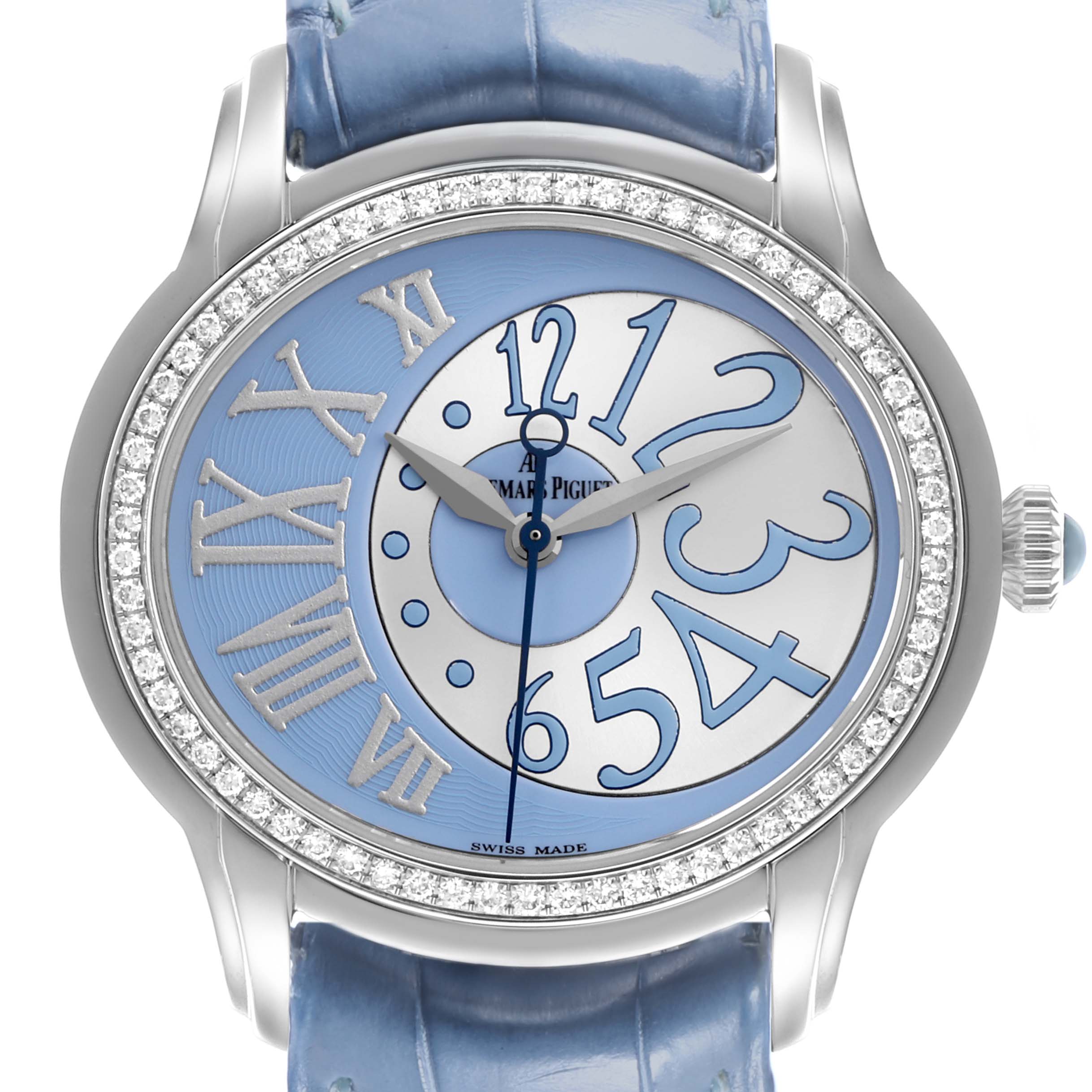 The Audemars Piguet Millenary 77301ST.ZZ.D303CR.01 Women's White Gold Blue Dial 77301ST.ZZ.D303CR.01 Women's White Gold Blue Dial watch is shown from a front angle, highlighting its dial, bezel, and strap.