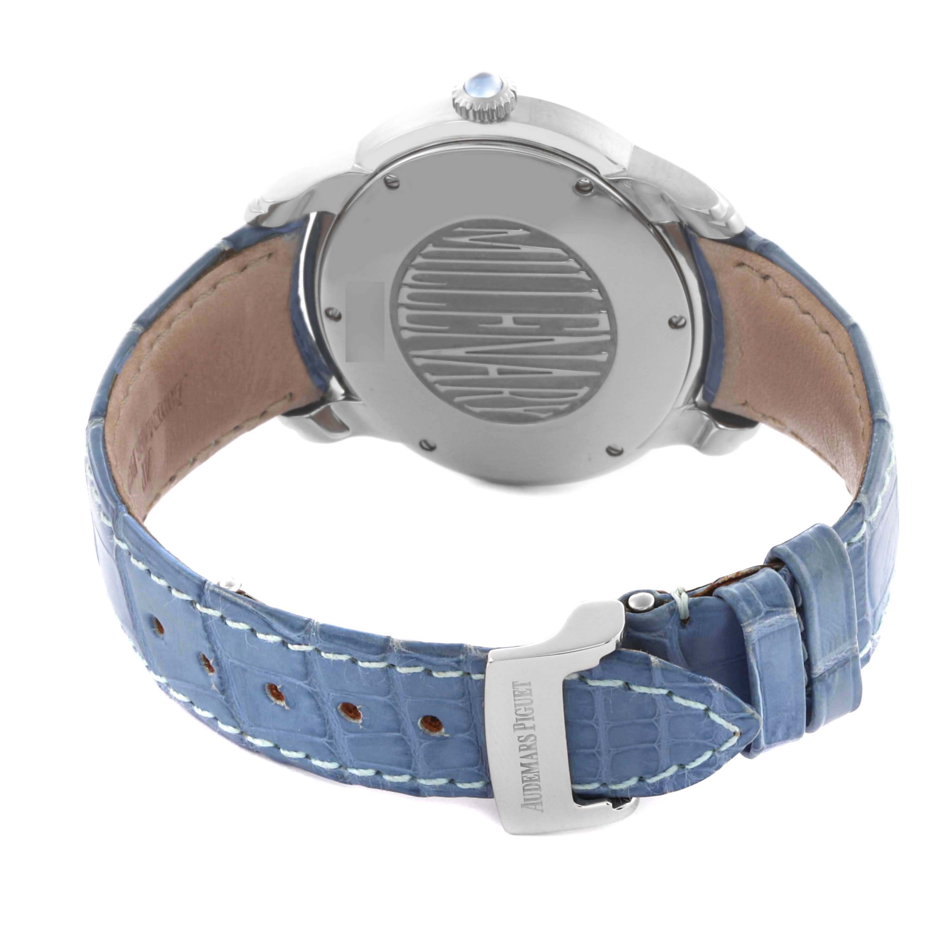 The image shows the back view of an Audemars Piguet Millenary 77301ST.ZZ.D303CR.01 Women's White Gold Blue Dial 77301ST.ZZ.D303CR.01 Women's White Gold Blue Dial watch, highlighting the case back and blue leather strap.