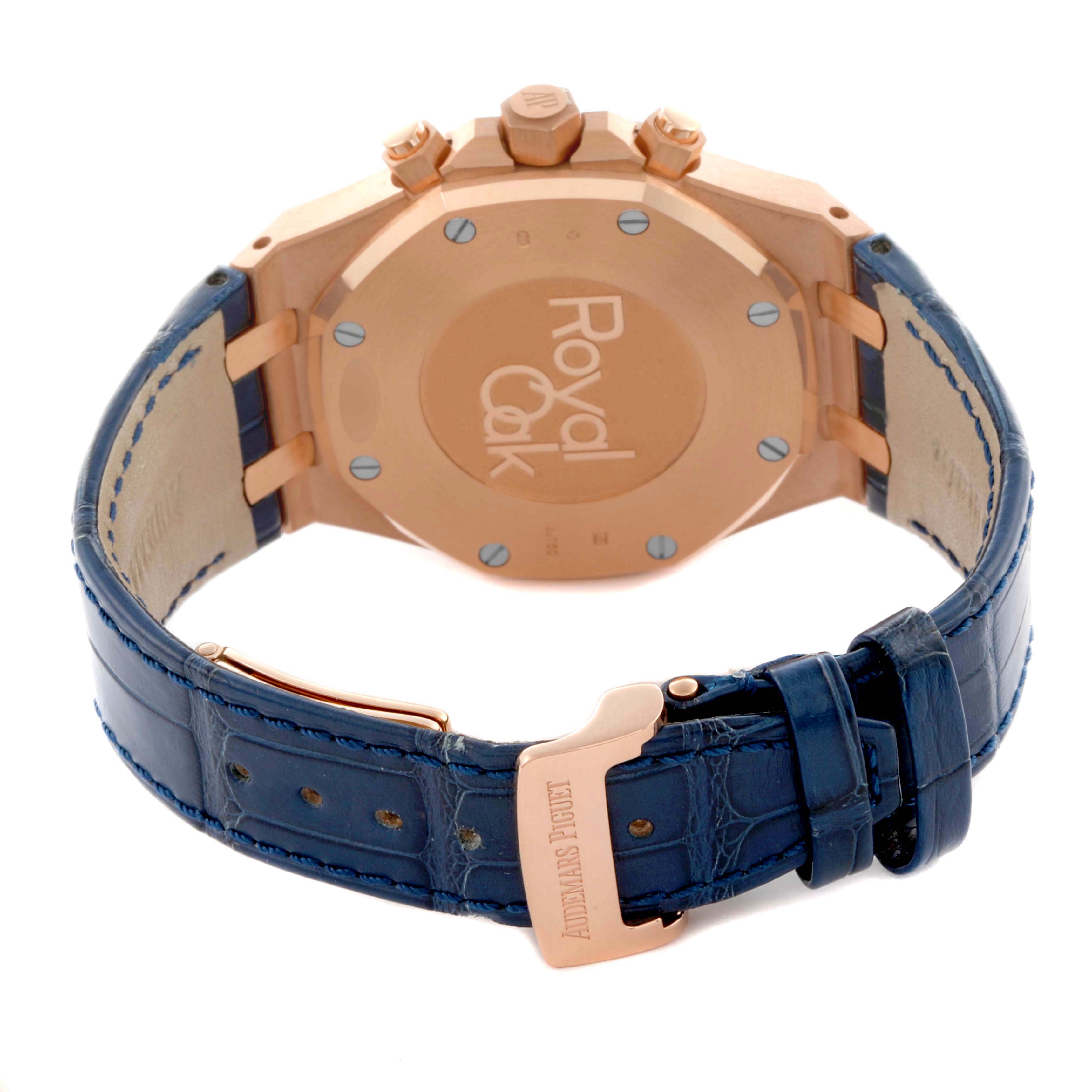 The image shows the back of the Audemars Piguet Royal Oak 26331OR.OO.D315CR.01 Men's Rose Gold Blue Dial 26331OR.OO.D315CR.01 Men's Rose Gold Blue Dial watch, highlighting its case back, blue leather strap, and clasp.