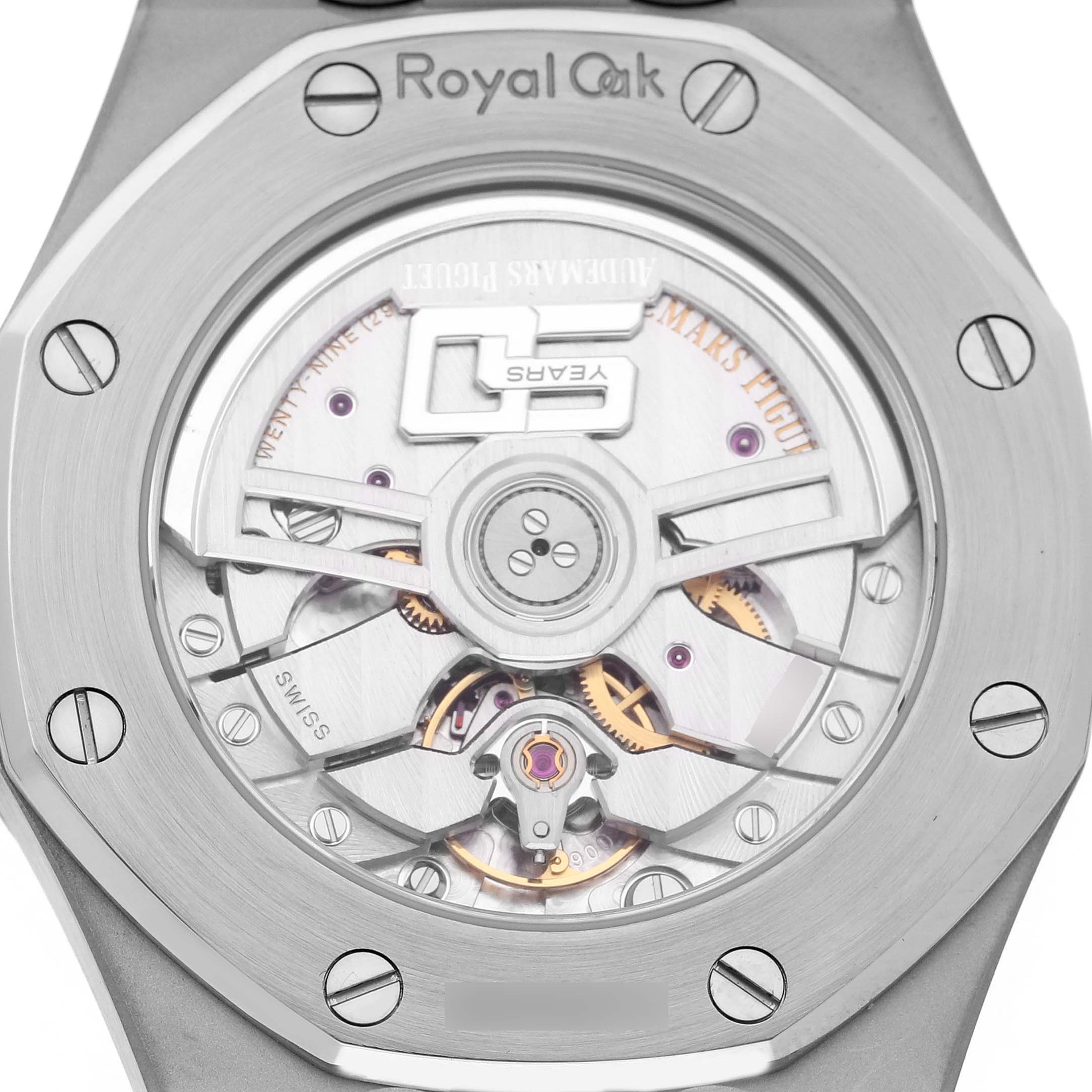 The image shows the back view of an Audemars Piguet Royal Oak 15550ST.00.1356ST.06 Men's Stainless Steel Blue Dial watch, highlighting its movement and caseback screws.