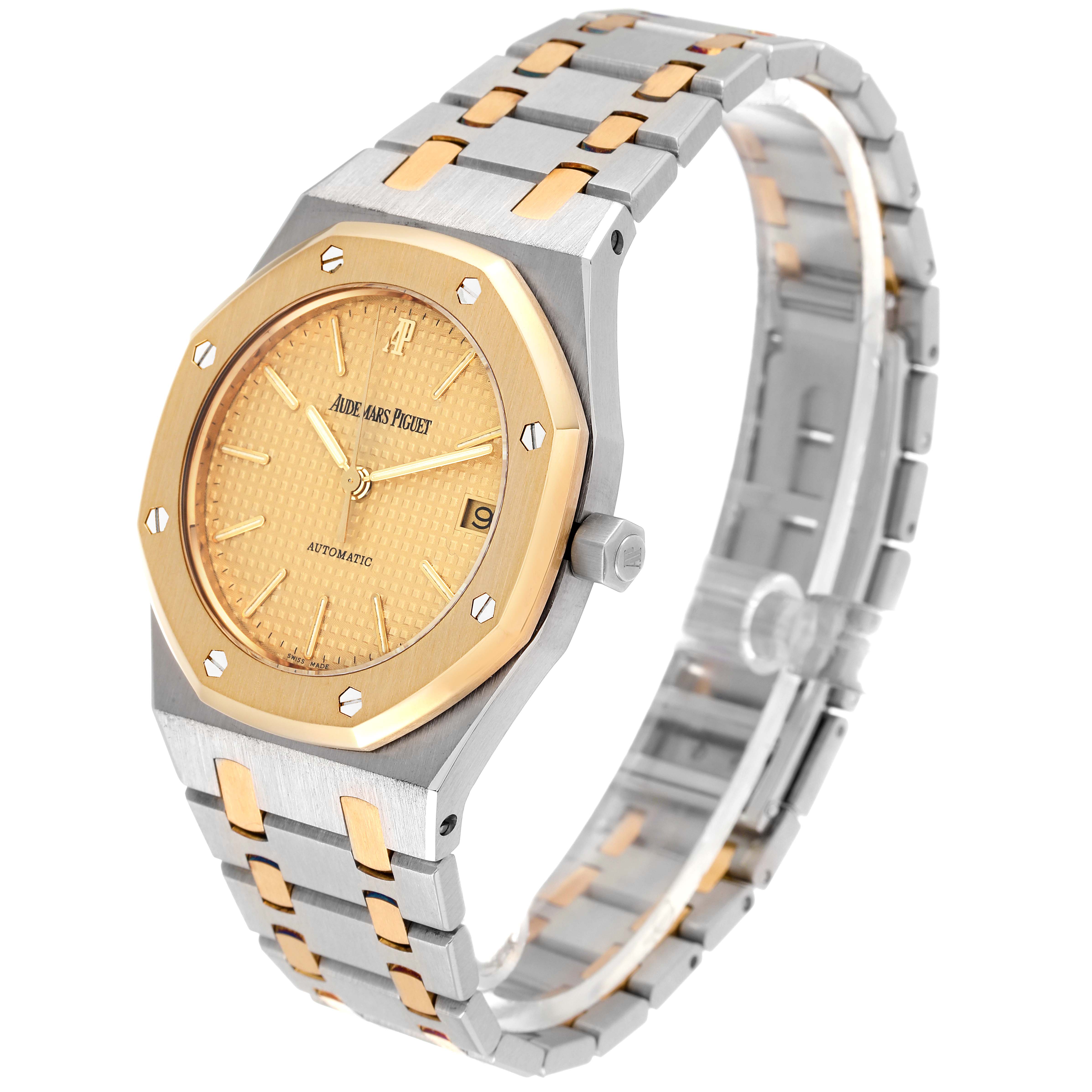 The image shows an angled view of the Audemars Piguet Royal Oak 14790SA Men's Steel and Gold (two tone) Champagne Dial 14790SA Men's Steel and Gold (two tone) Champagne Dial watch, highlighting its dial, bezel, and two-tone bracelet.