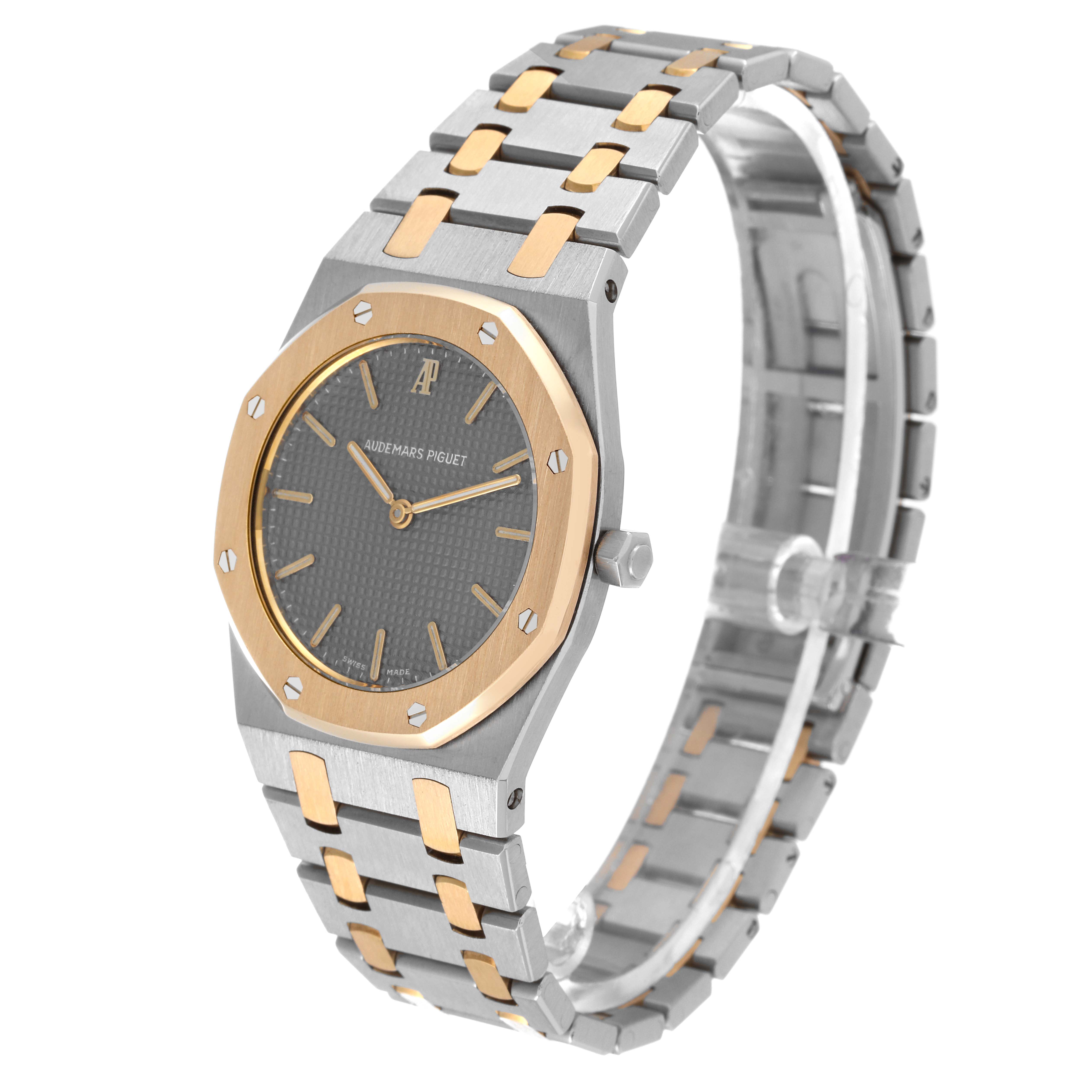 This image shows a Royal Oak model by Audemars Piguet at a three-quarter angle, highlighting the face, bezel, crown, and bracelet.