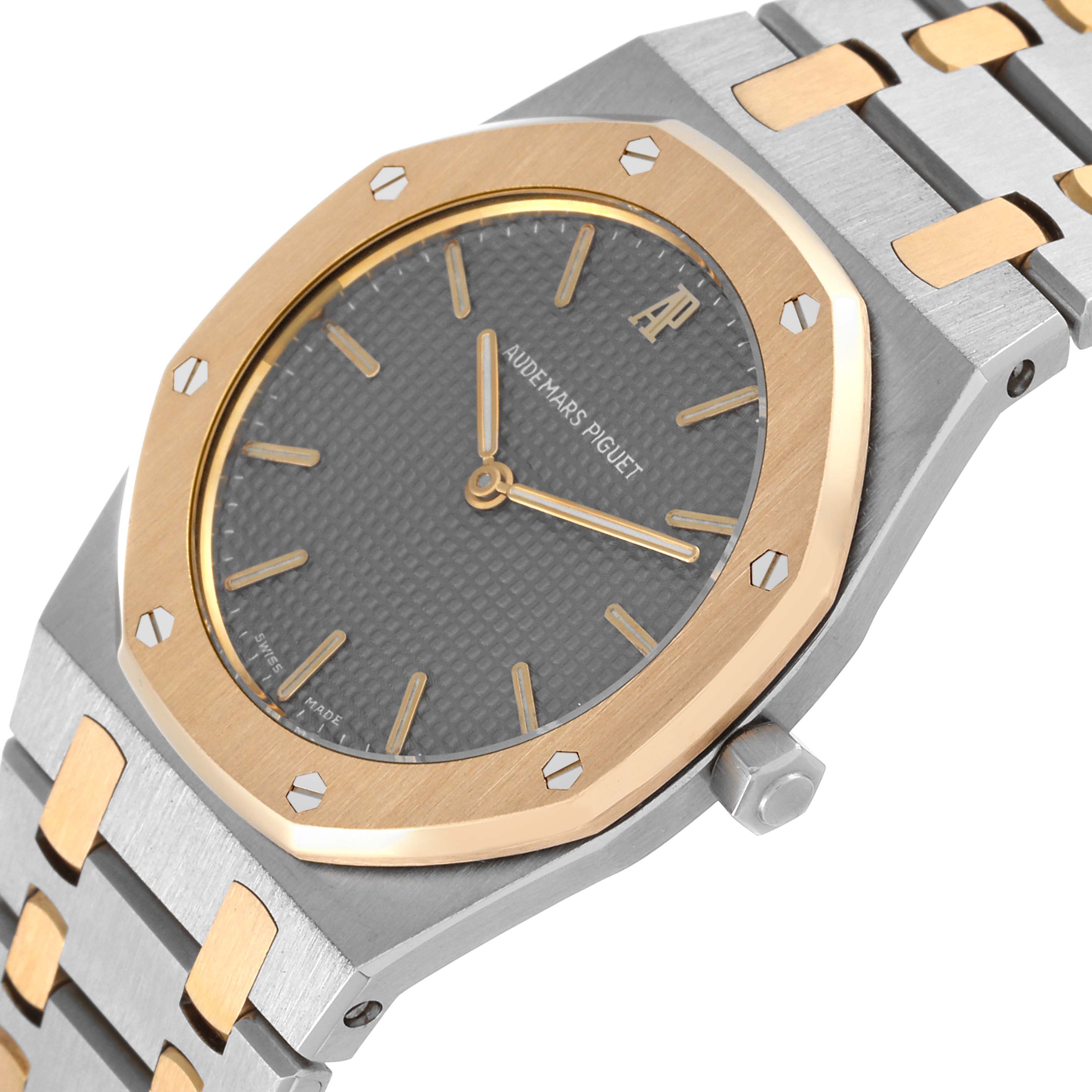 The image shows a close-up of the Audemars Piguet Royal Oak 56303SA Men's Steel and Gold (two tone) Grey Dial 56303SA Men's Steel and Gold (two tone) Grey Dial watch's face and part of its metal and gold bracelet.
