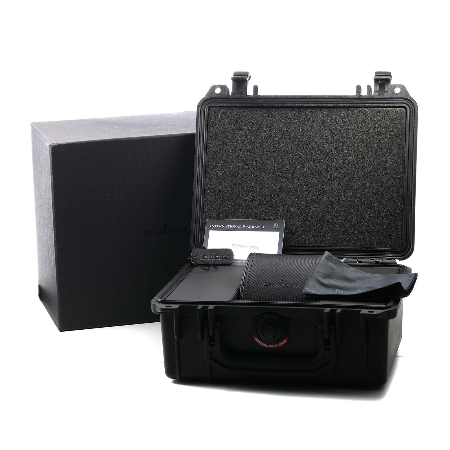 The image shows the open packaging for the Blancpain Fifty Fathoms 5200-0130-B52A Men's Ceramic Black Dial, including a case, warranty card, and polishing cloth.