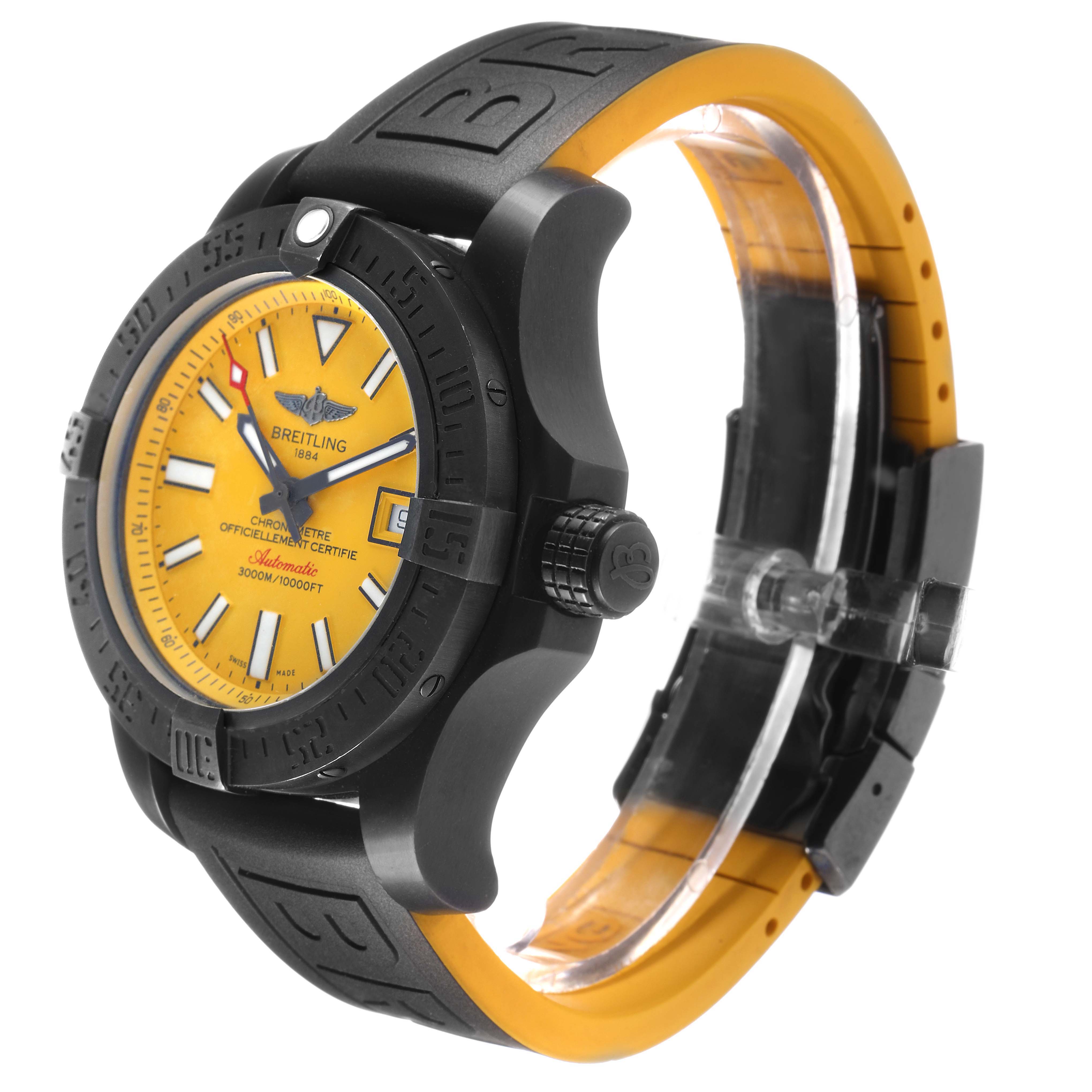 The image shows a side angle of the Breitling Avenger M17331 Men's Stainless Steel Yellow Dial watch, highlighting its yellow dial, black bezel, and rubber strap.