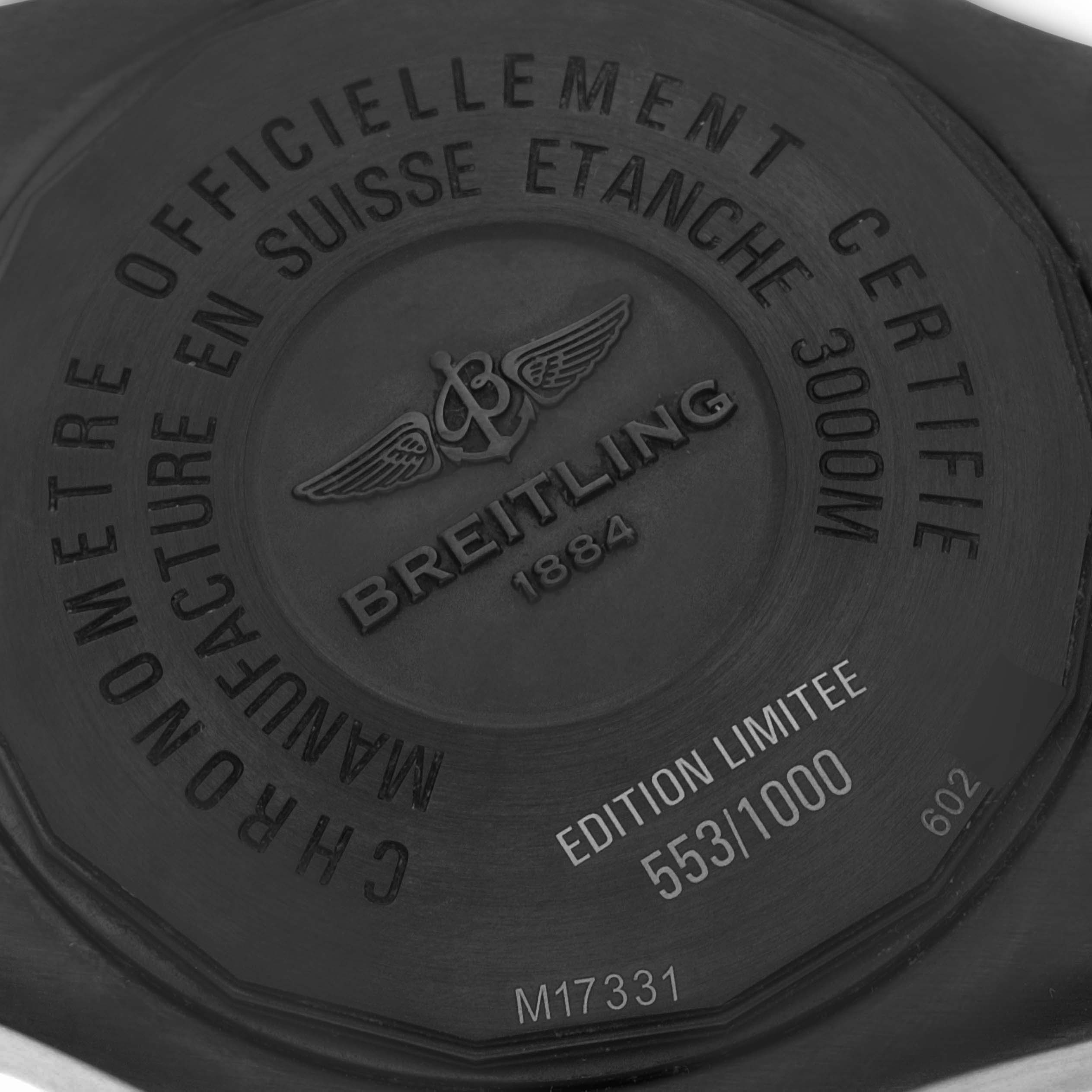 The image shows the case back of the Breitling Avenger M17331 Men's Stainless Steel Yellow Dial watch, highlighting the brand logo, model details, and limited edition number.