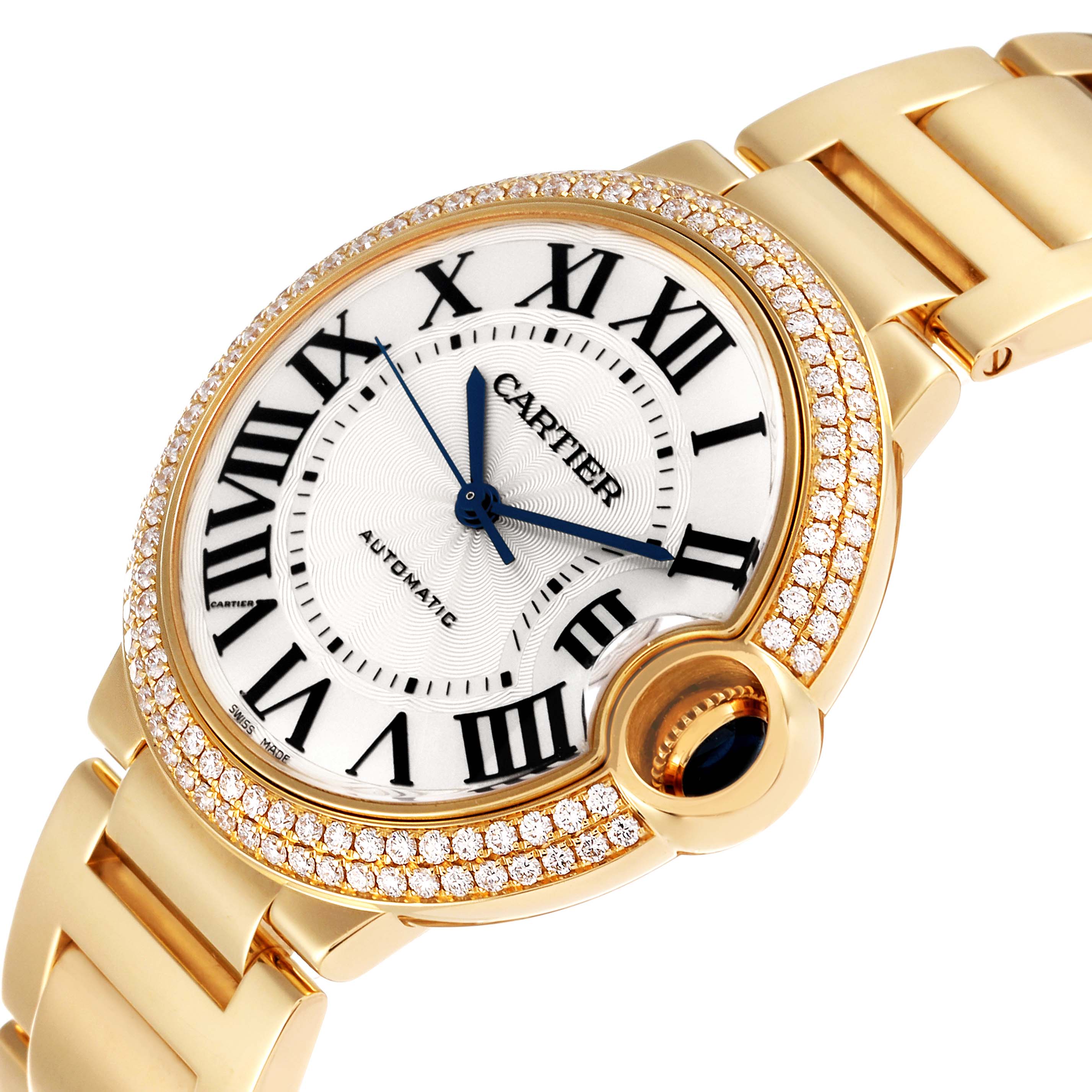 The image shows a close-up angle of a Cartier Ballon Bleu WE9004Z3 Women
s Yellow Gold Silver Dial WE9004Z3 Women
s Yellow Gold Silver Dial watch, highlighting its diamond-set bezel, white dial, and Roman numerals.