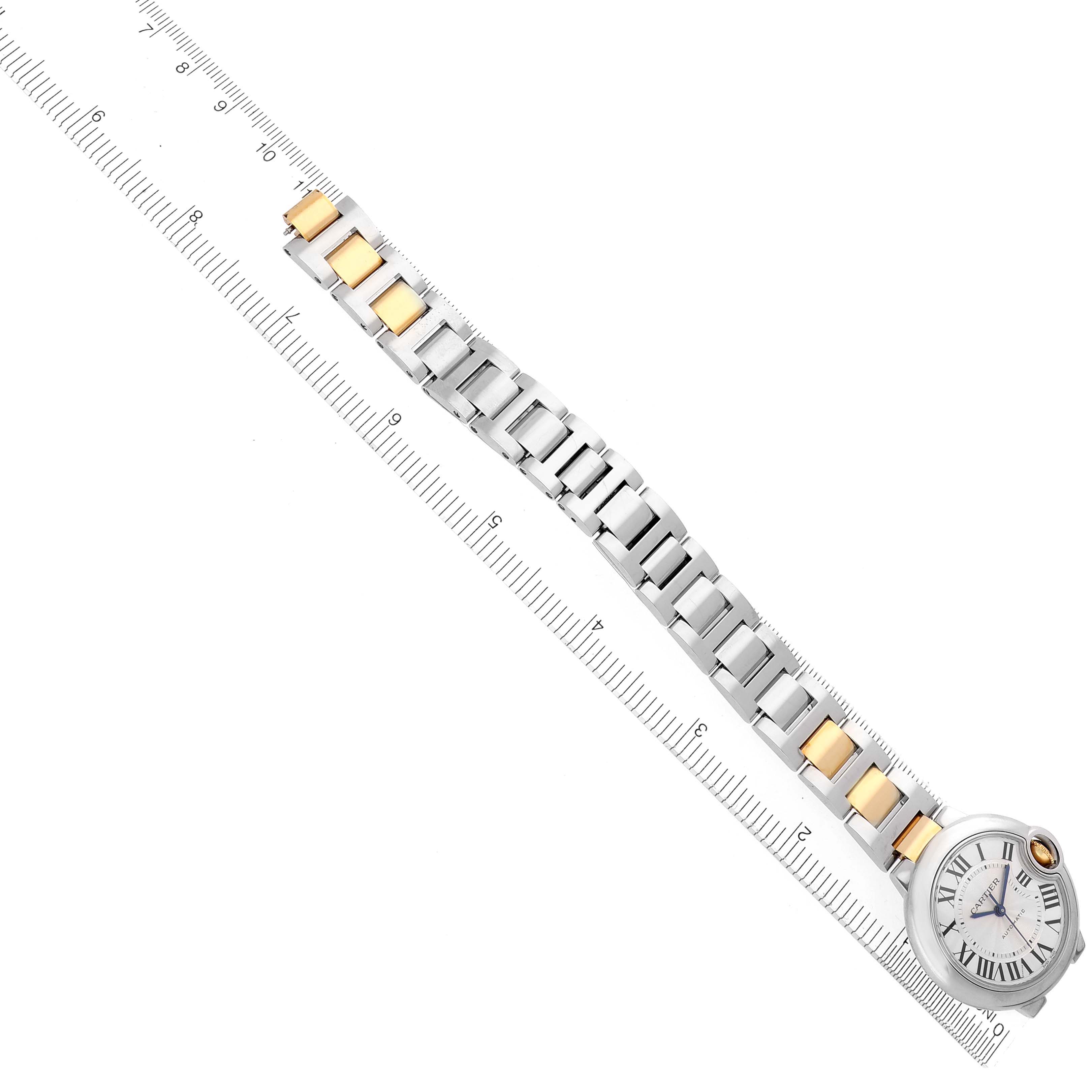The Cartier Ballon Bleu W2BB0002 Women's Steel and Gold (two tone) Silver Dial W2BB0002 Women's Steel and Gold (two tone) Silver Dial watch is shown from a top-down angle, highlighting the two-tone bracelet and round face with Roman numerals.
