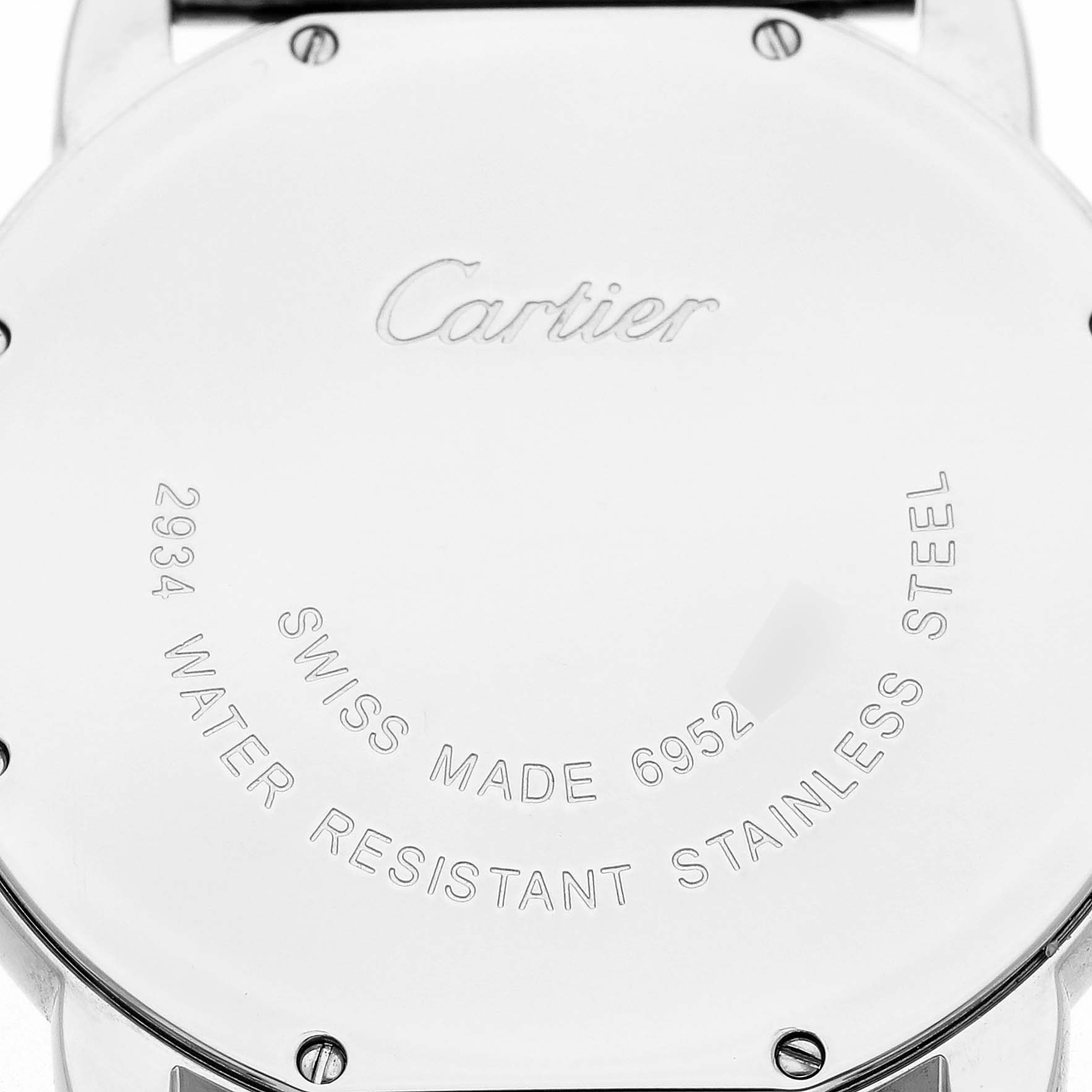 The image shows the back case of a Cartier Ronde W6701005 Men's Stainless Steel Silver Dial watch, displaying engravings of the brand, model number, and material details.