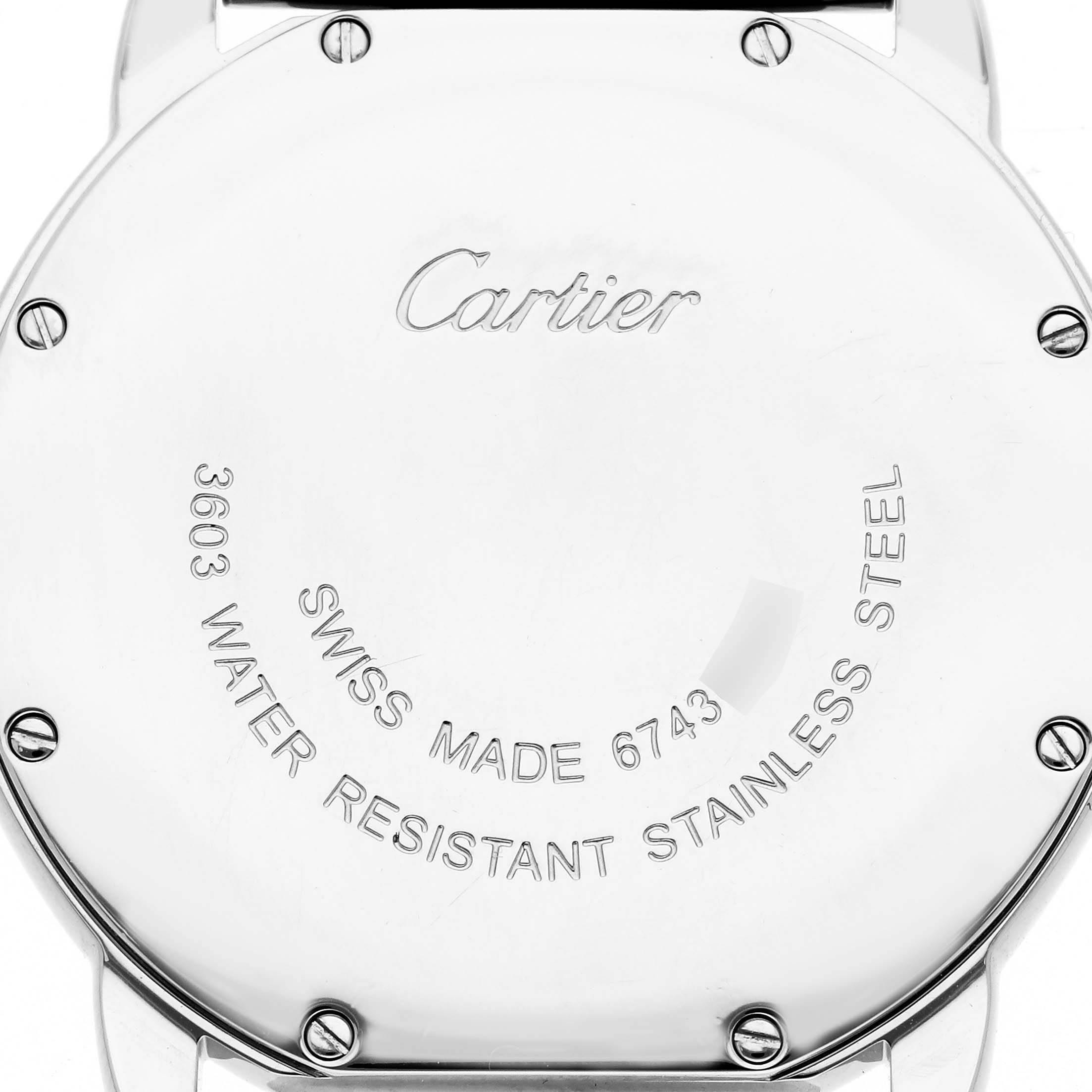 The image shows the back of a Cartier Ronde W6701005 Men
s Stainless Steel Silver Dial W6701005 Men
s Stainless Steel Silver Dial watch, highlighting its stainless steel case and inscriptions.