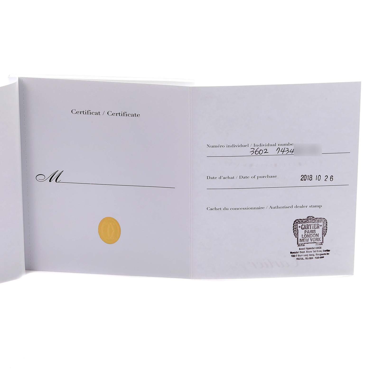 The image shows an open certificate booklet for the Cartier Ronde W6701008 Men's Steel and Gold (two tone) Silver Dial W6701008 Men's Steel and Gold (two tone) Silver Dial model, displaying purchase details and an authorized dealer stamp.