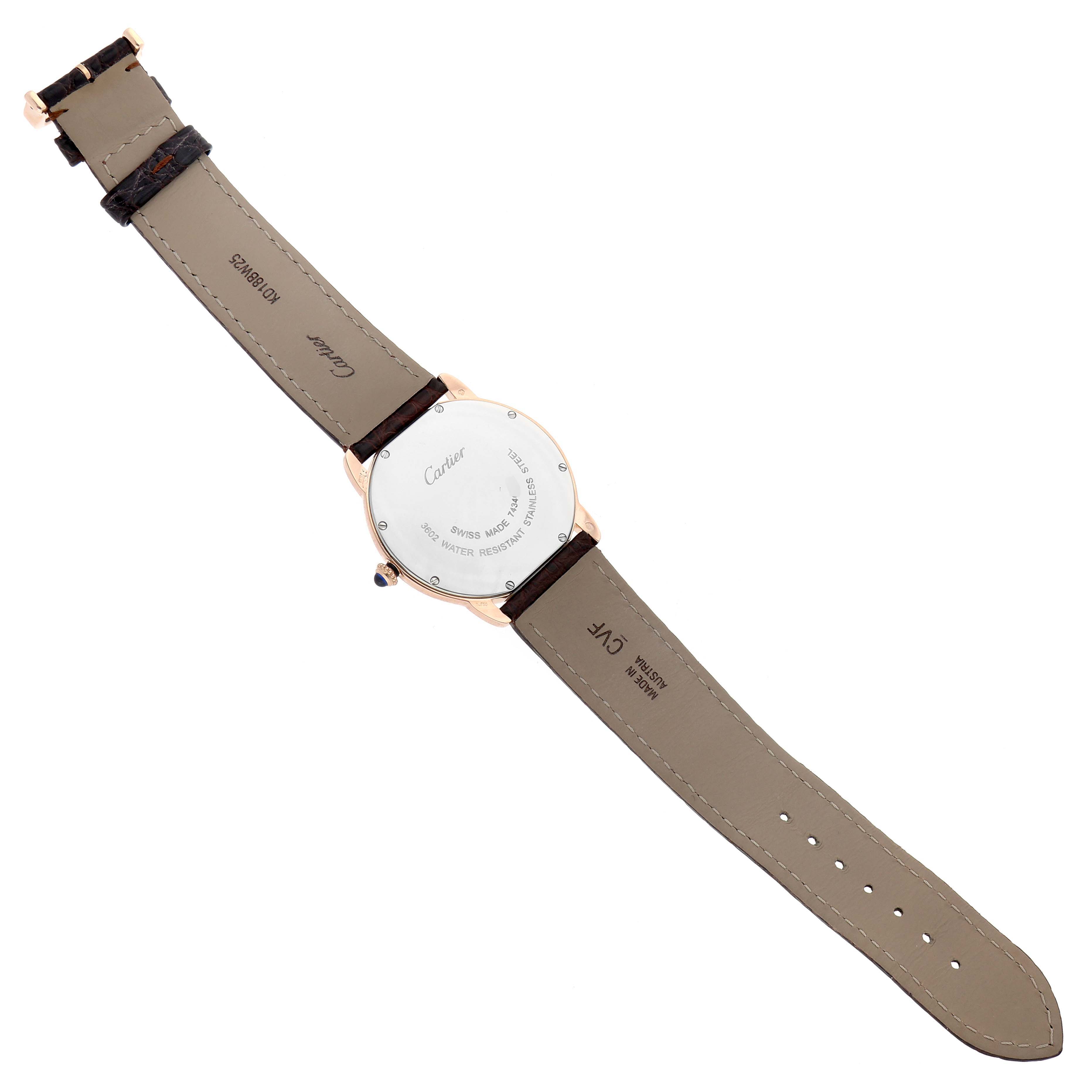 The Cartier Ronde W6701008 Men's Steel and Gold (two tone) Silver Dial W6701008 Men's Steel and Gold (two tone) Silver Dial watch is shown from the back, highlighting the case back, leather strap, and clasp.